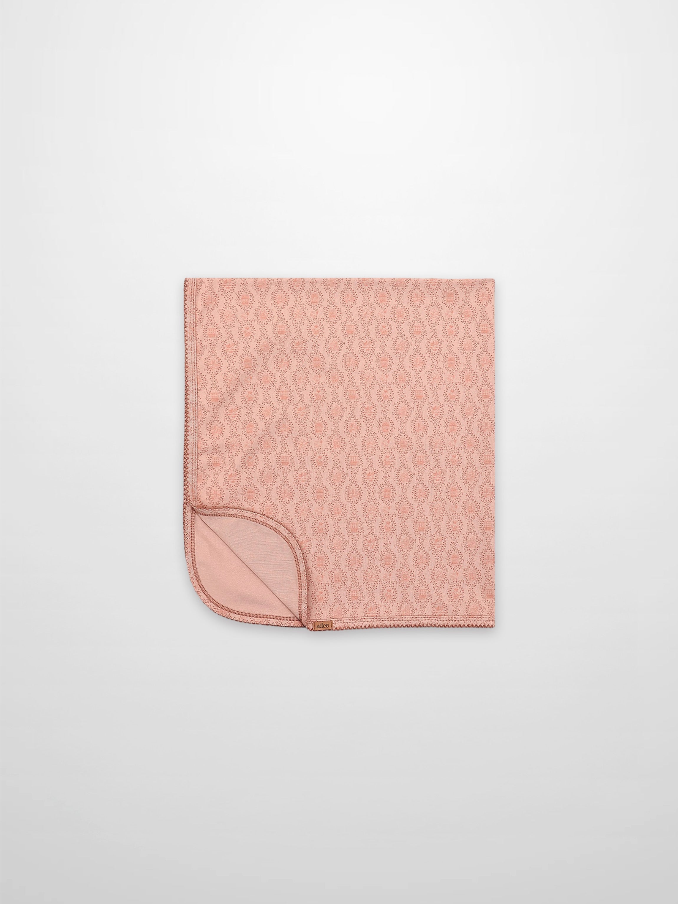 Pink Charm Blanket by Adee; light pink patterned receiving blanket for girls.