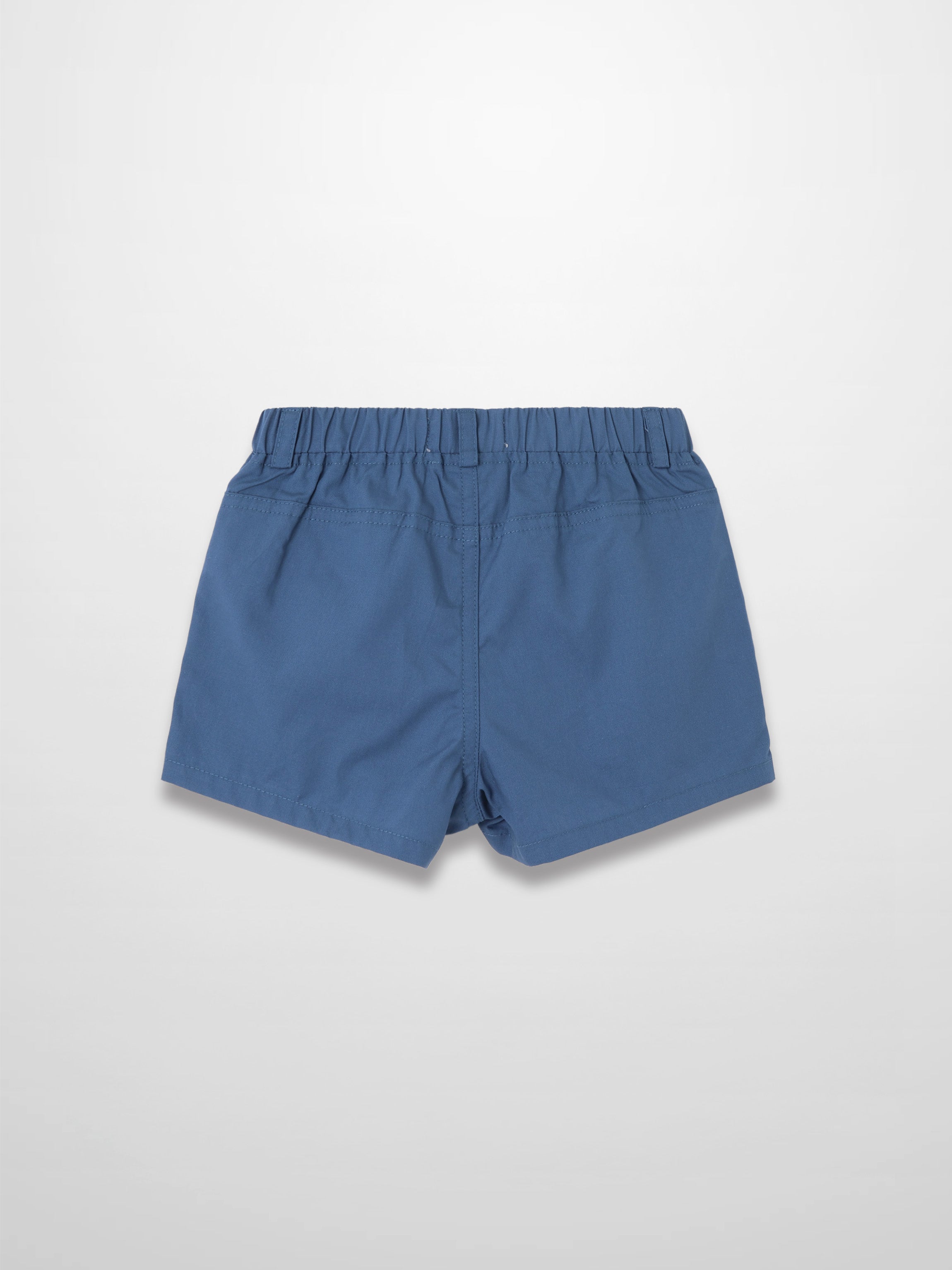 Back view of blue cotton shorts with elastic waistband and stitch details.
