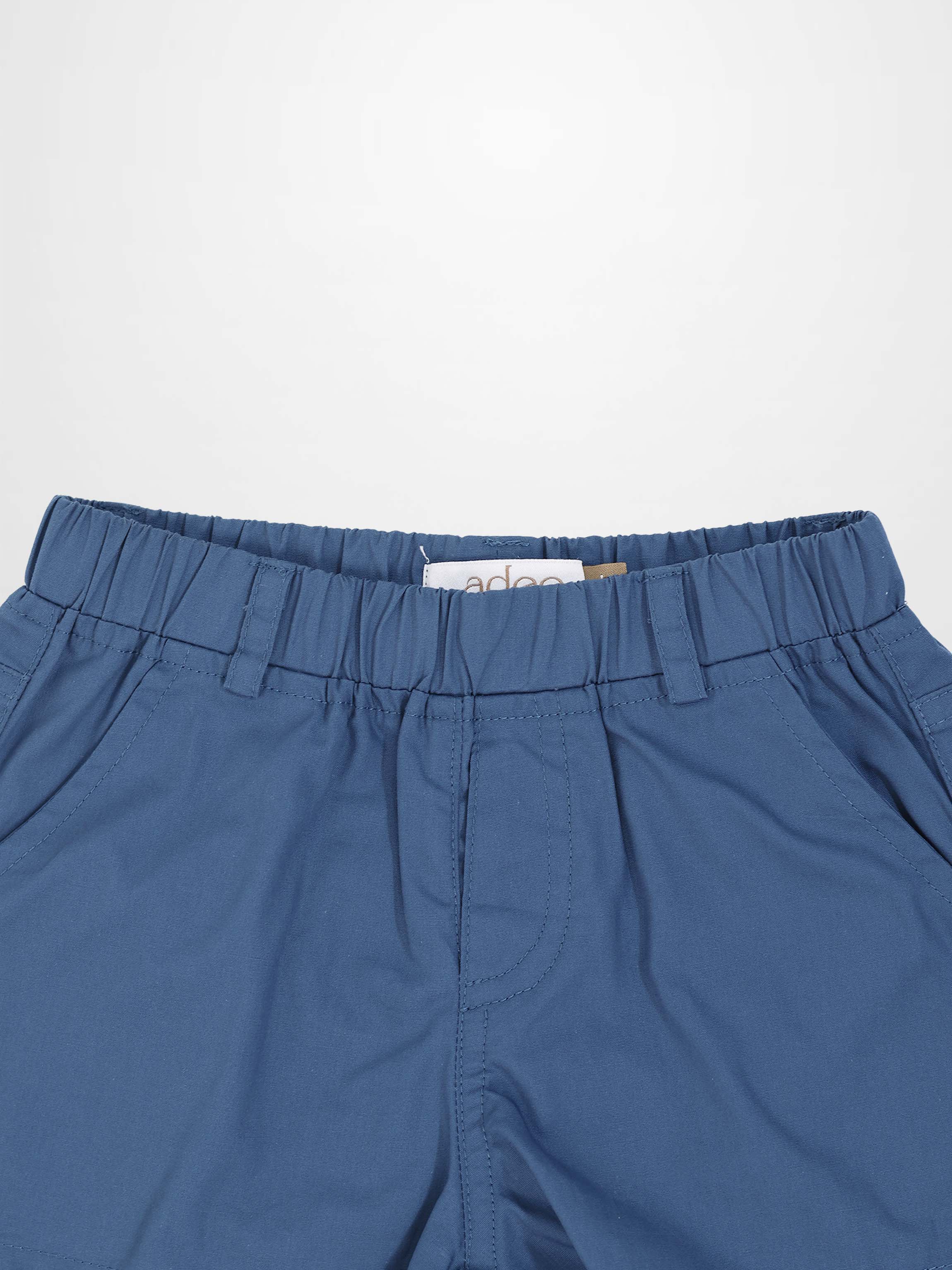 Blue cotton shorts with an elastic waistband and belt loops.