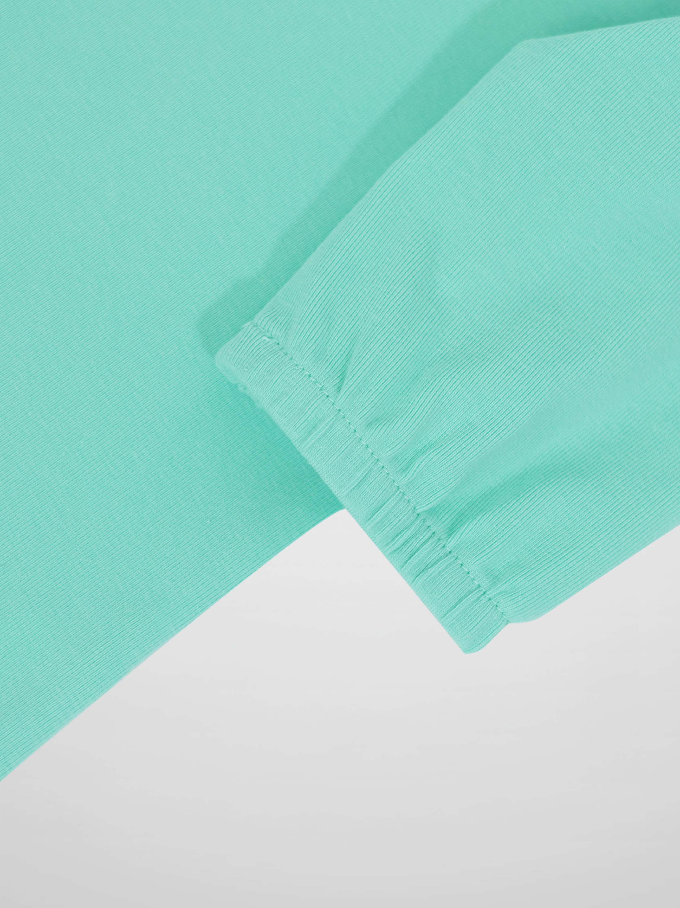 Mint green 3/4 puff sleeve T-shirt cuff detail