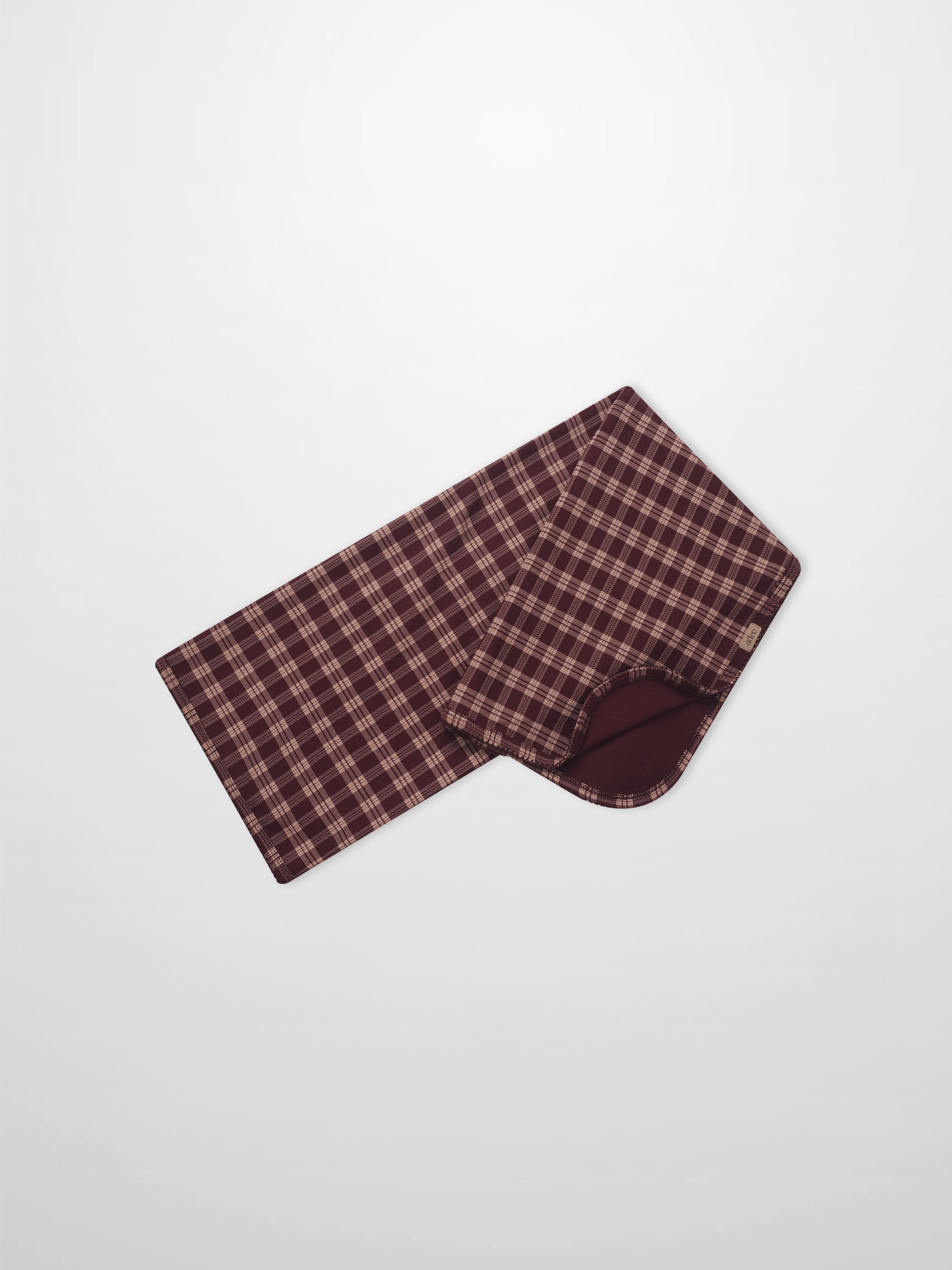 Swaddle blanket in burgundy plaid with scalloped trim by Adee