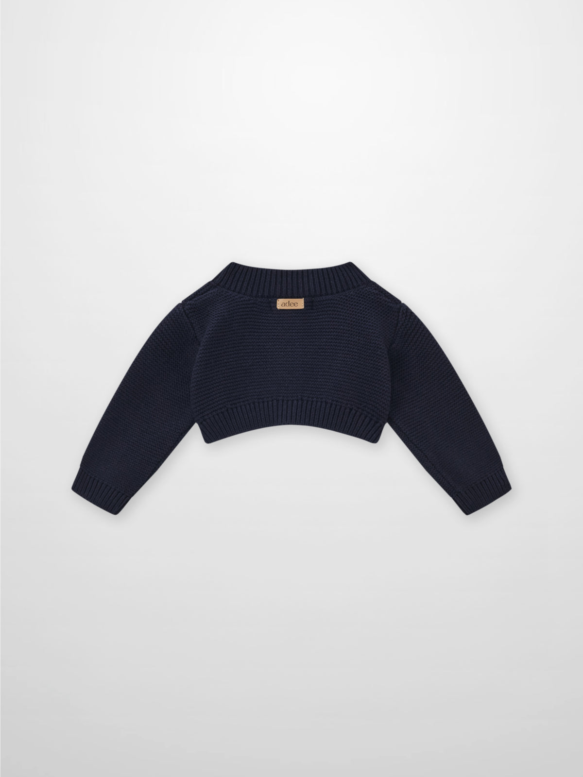 Cropped cardigan navy by Adee; unisex dressy knit with ribbed hem and cuffs.