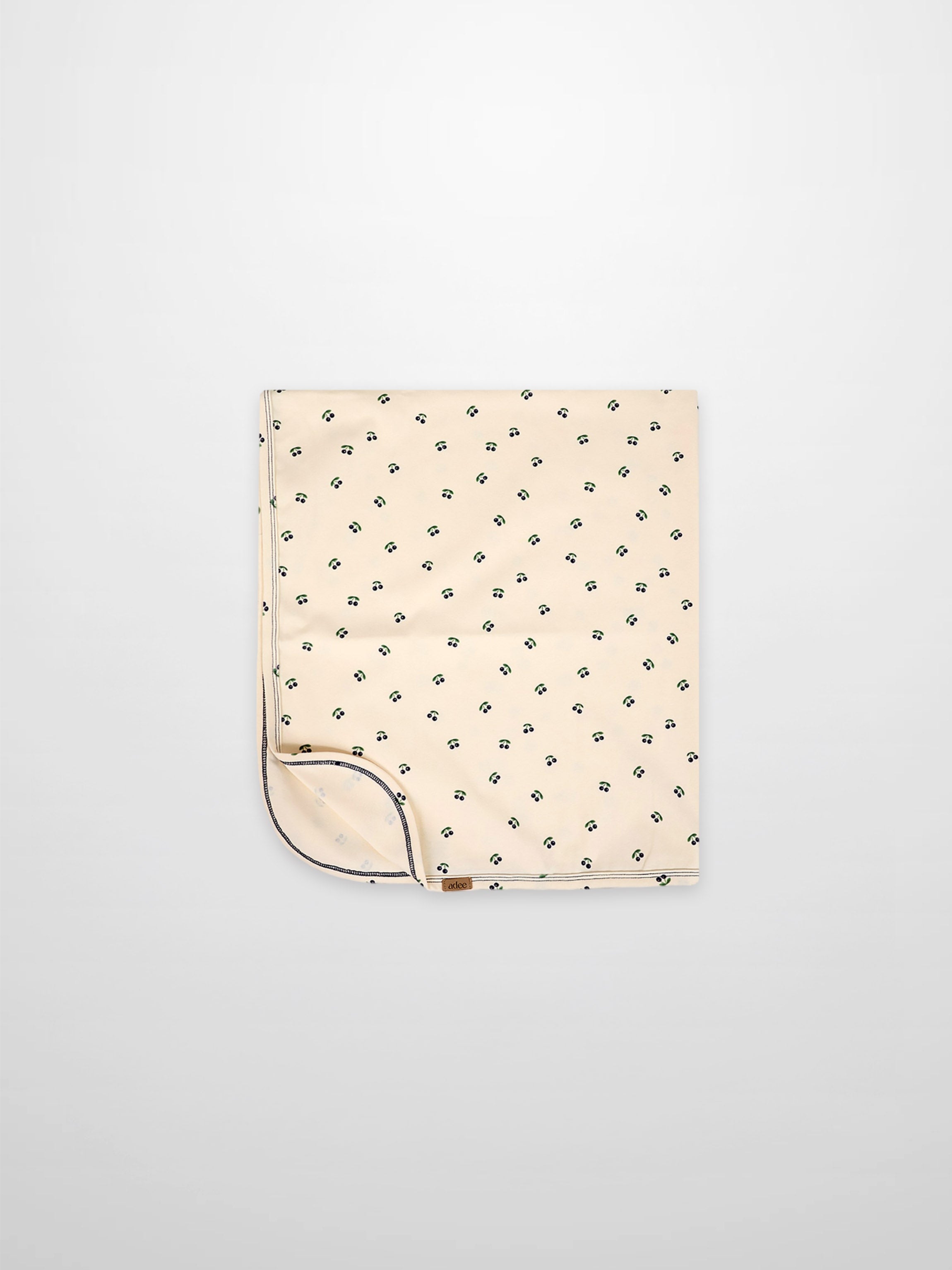 Blue Cherry Blanket, Adee boys swaddle blanket with scattered blue cherry print on cream fabric