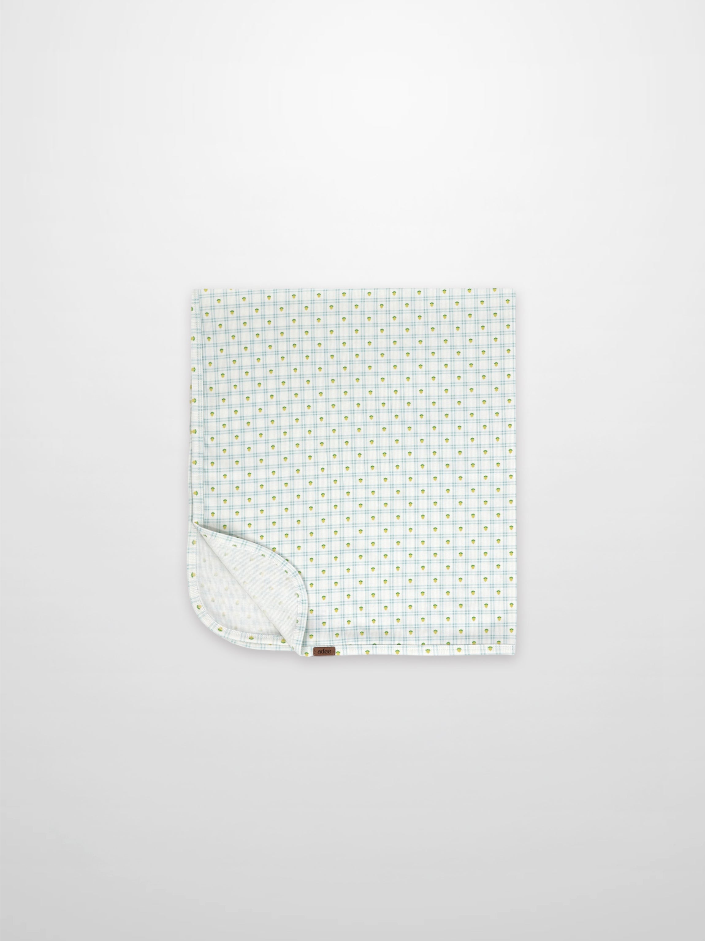 Lemon Window Blanket, Adee; boys swaddle blanket with white base, pale blue grid, and tiny yellow dots.