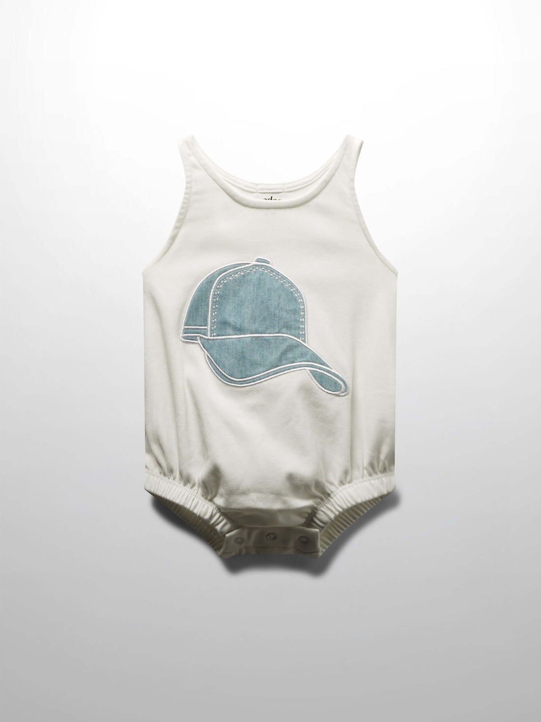White baby romper with baseball cap