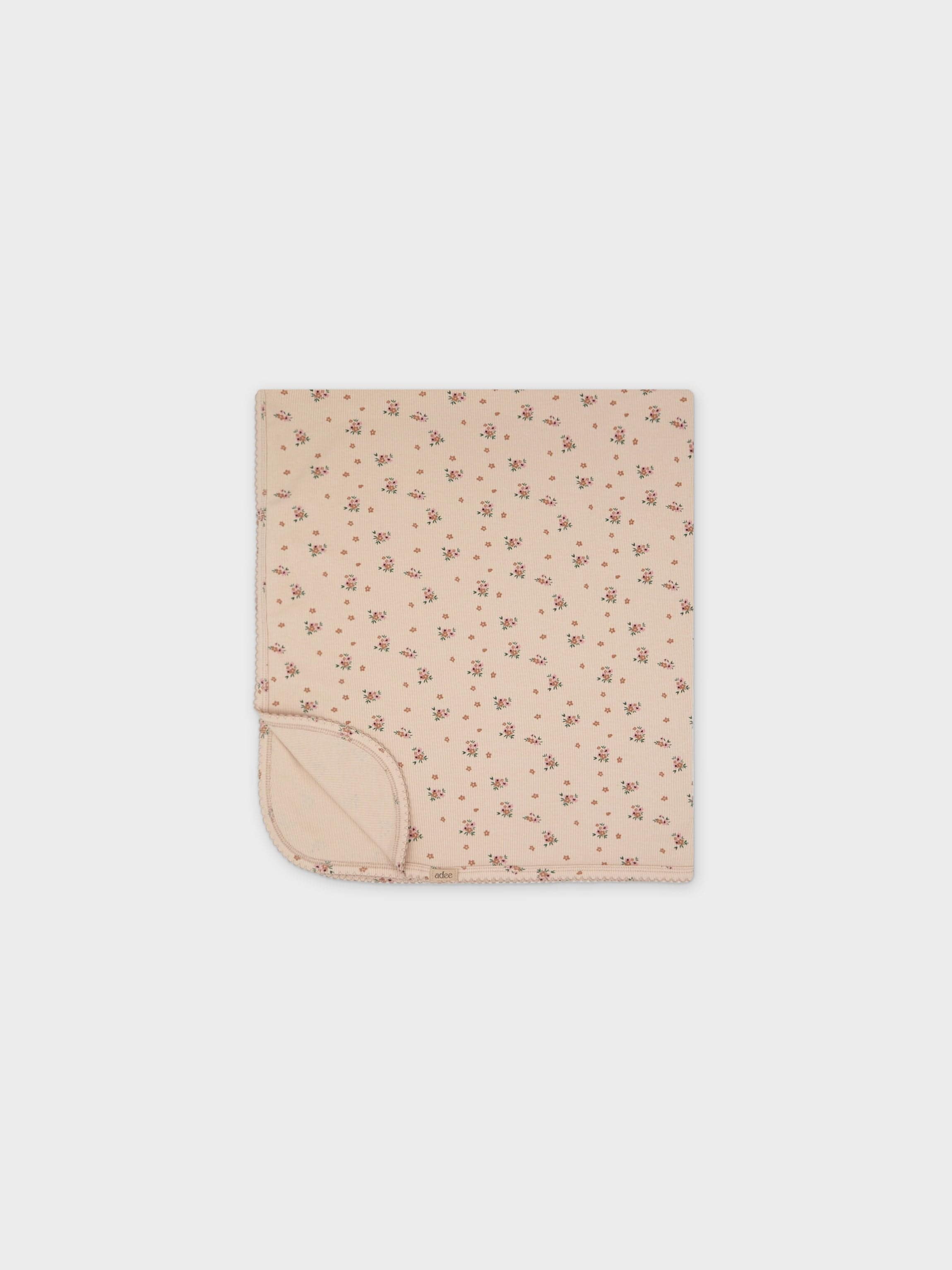 Tan baby blanket with flowers
