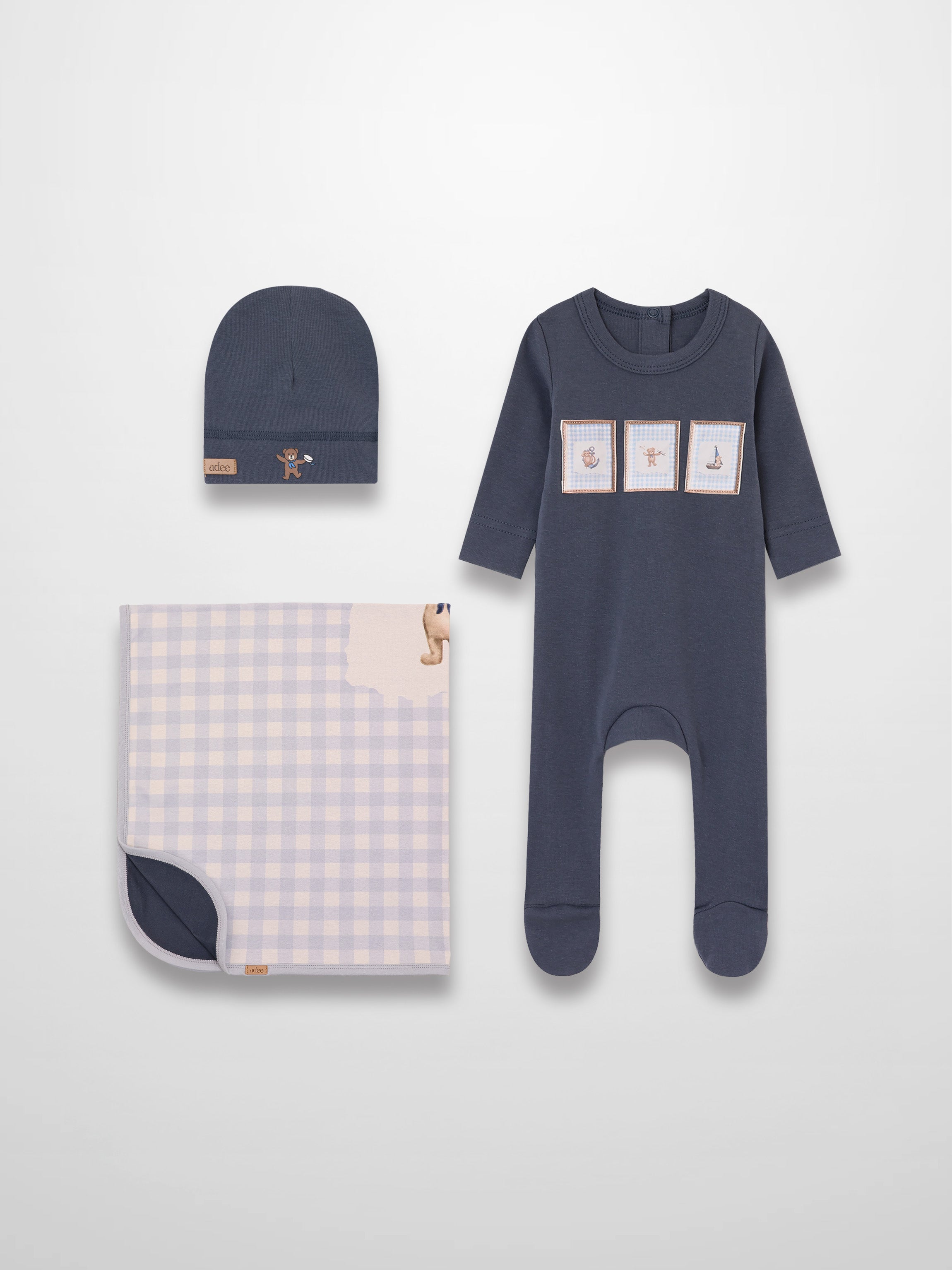 Teddy Frame Layette Set 3-piece baby boys by Adee: navy romper with patches, navy beanie, lavender gingham blanket.