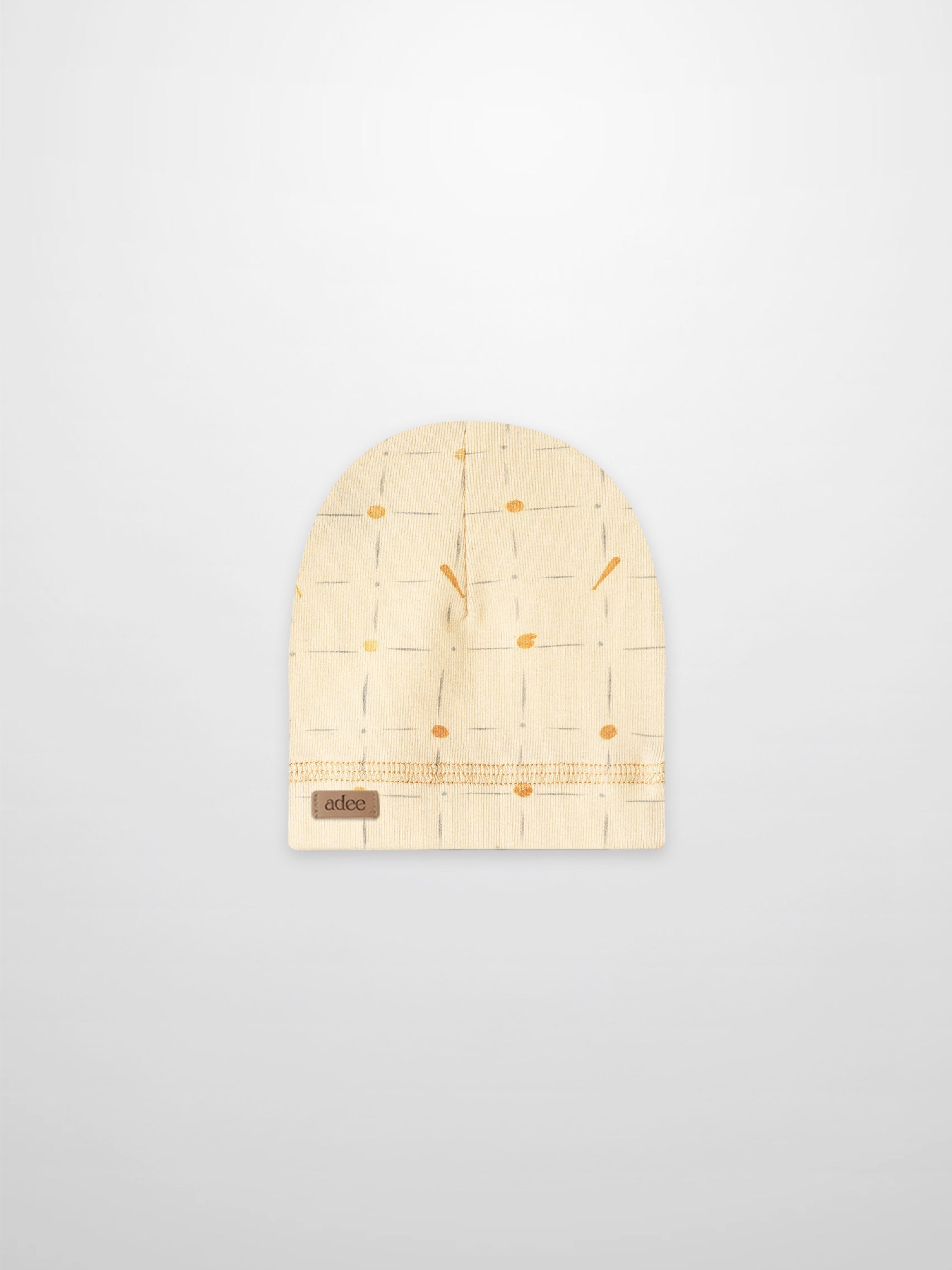 Grand Slam hat for boys by Adee; beige knit beanie with pale blue grid lines and orange dots.