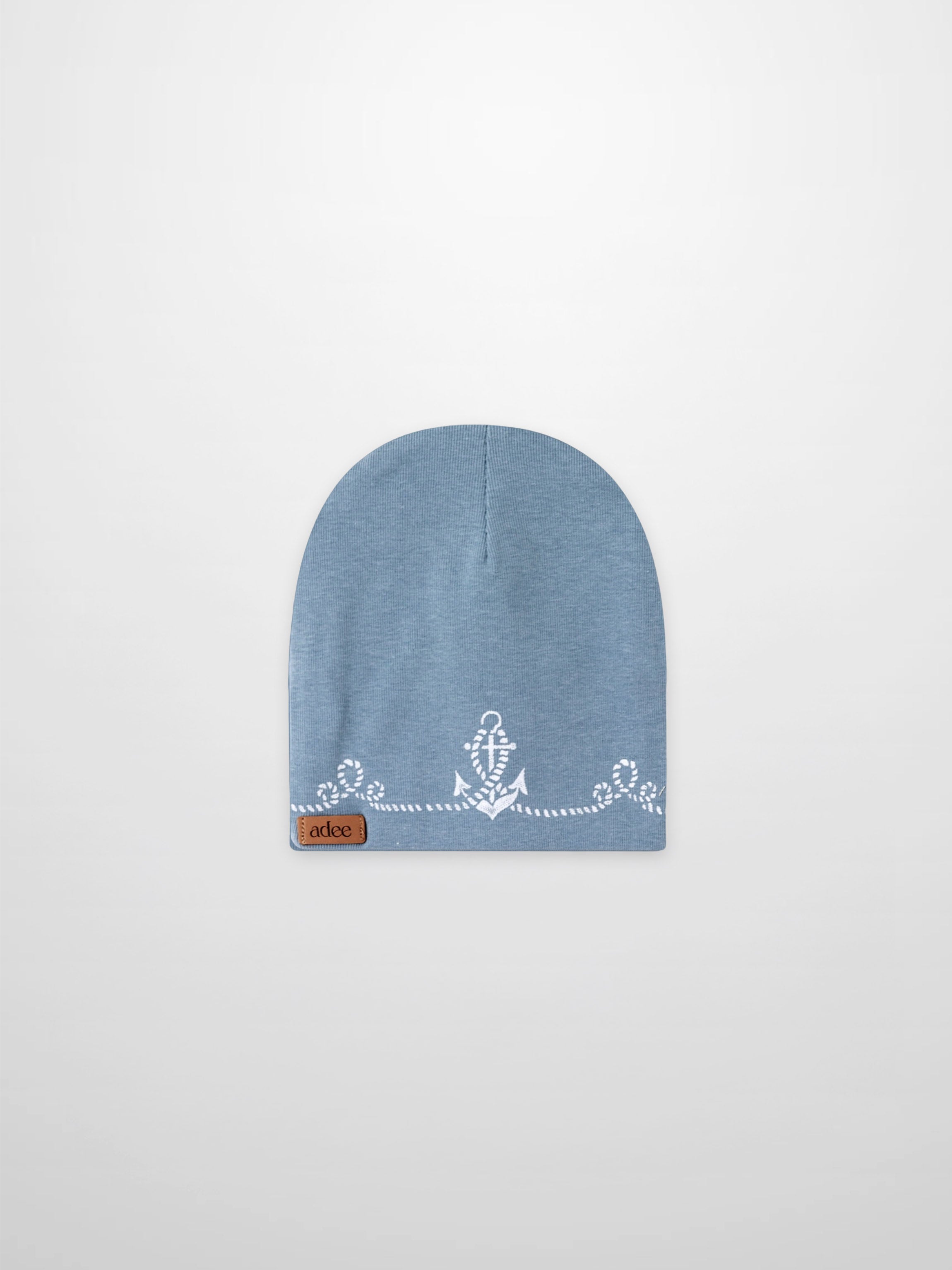 Blue Anchor Beanie for boys by Adee, a light blue knit hat with a white anchor motif and leather patch.