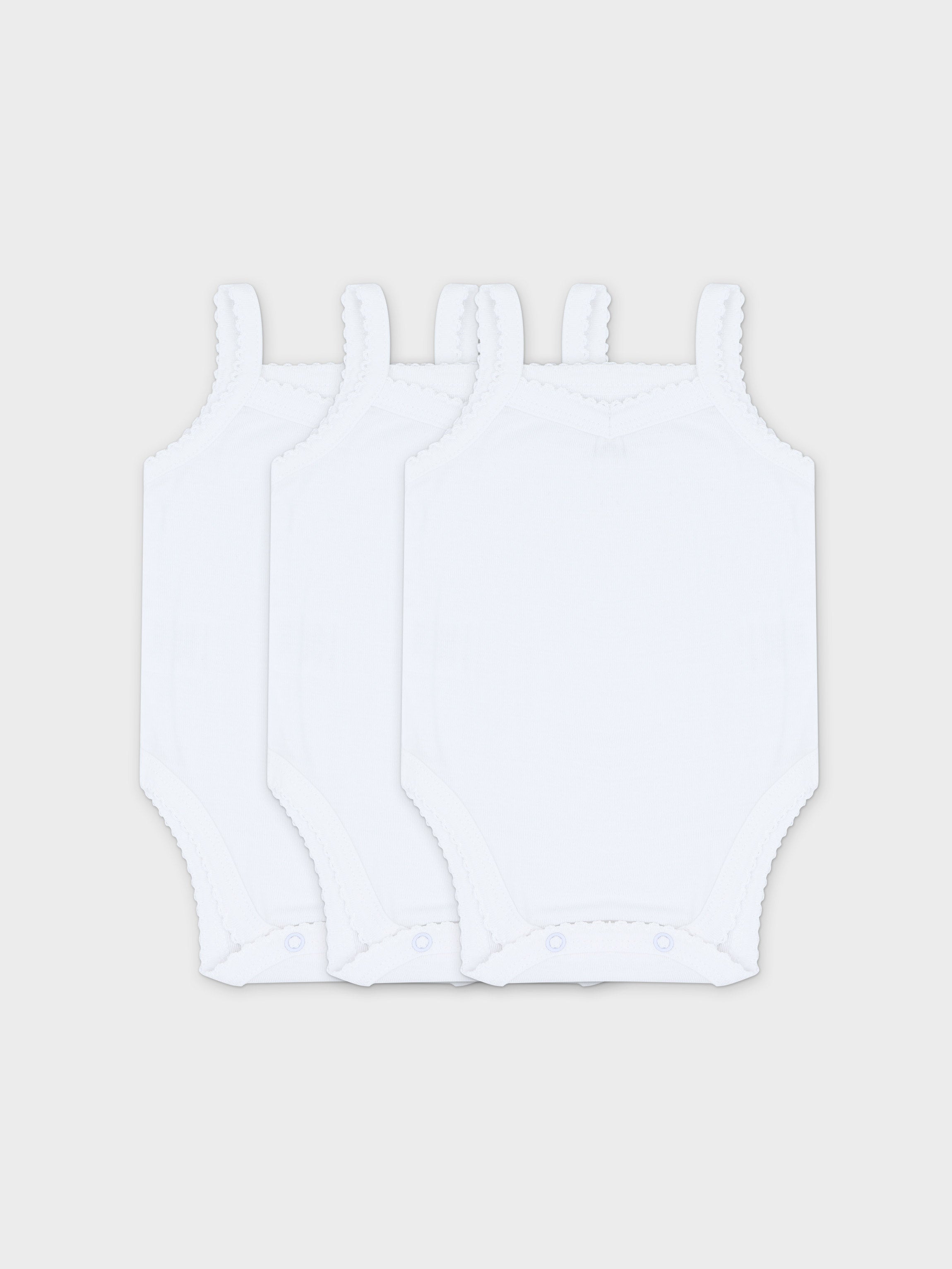 Set of three white baby bodysuits