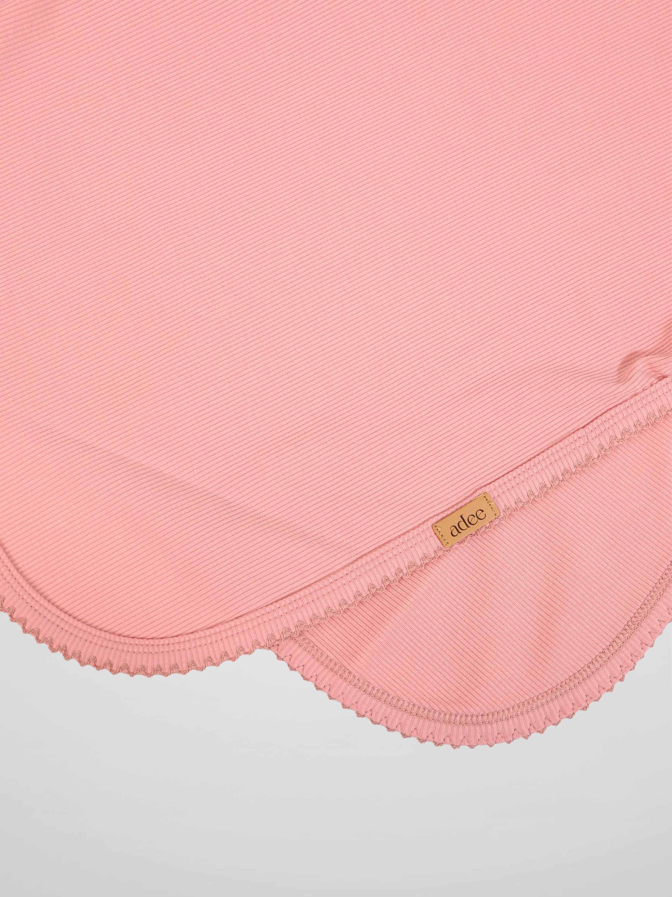 Thin ribbed pink swaddle blanket for girls by Adee with scalloped edge trim