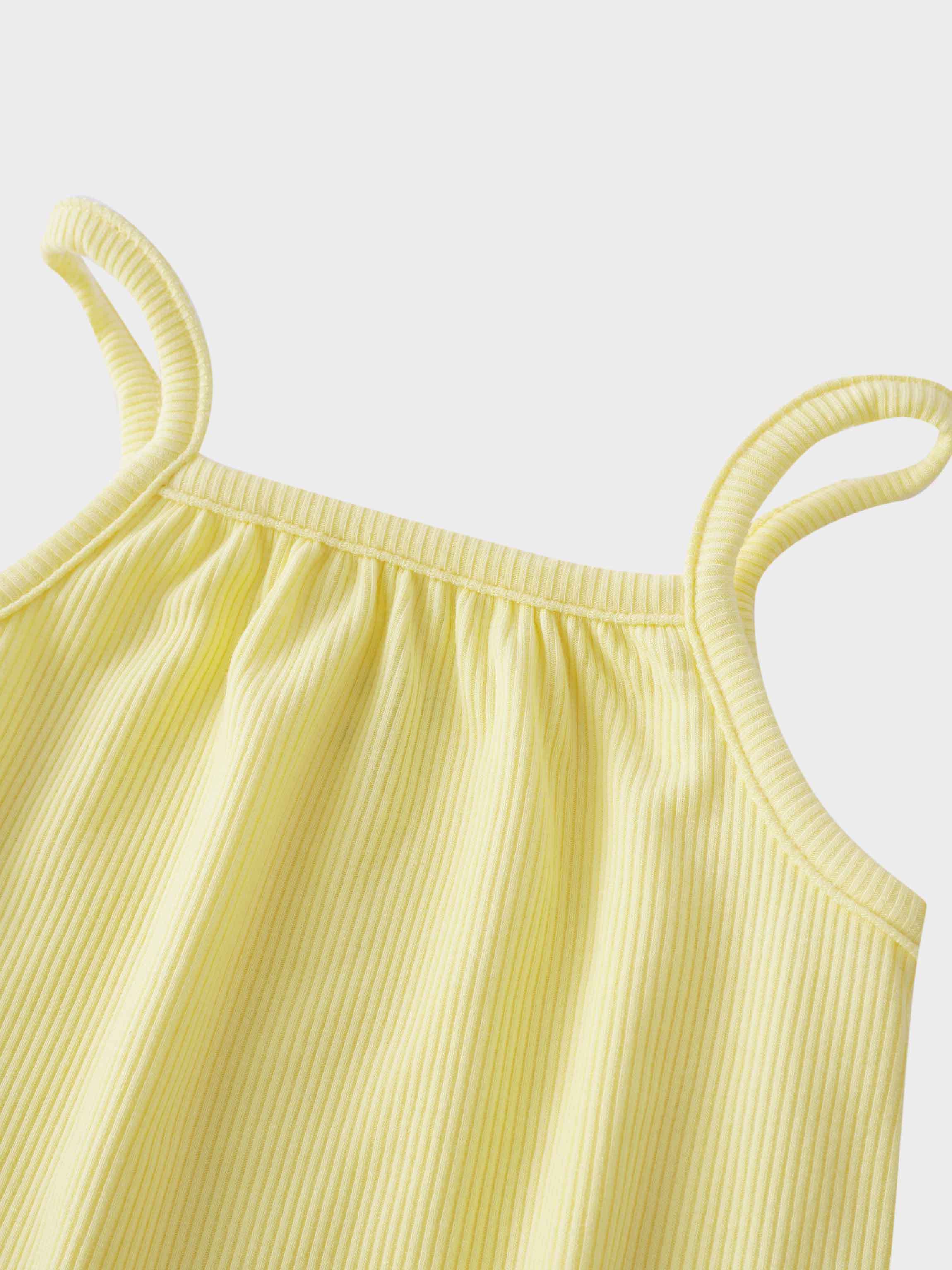 Soft yellow romper shoulder straps