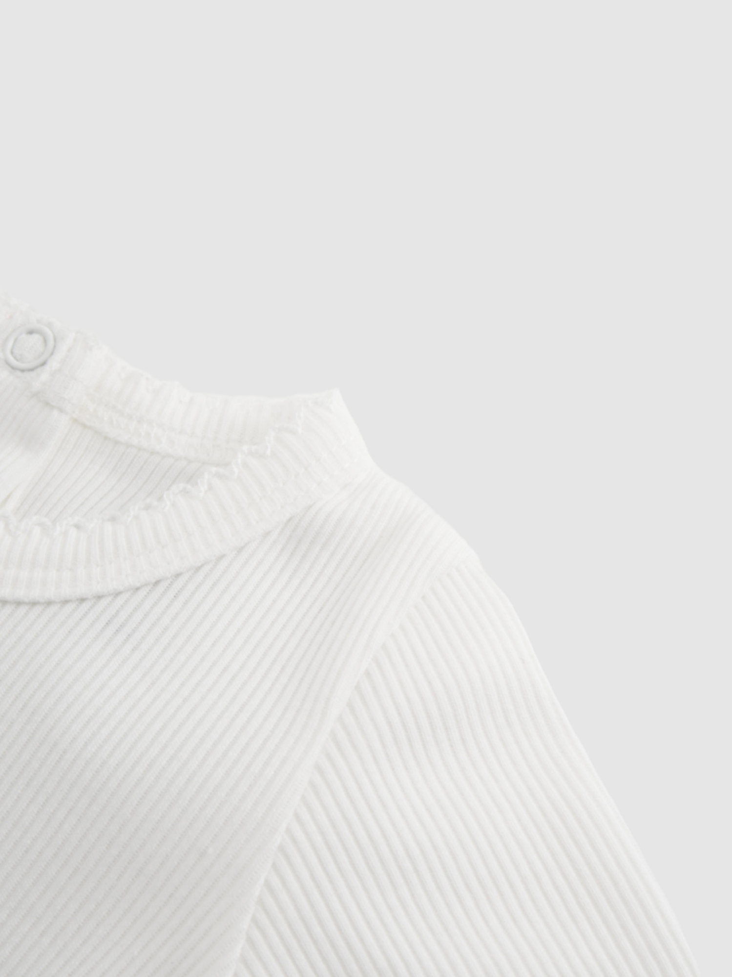 Girls Stretchies white ribbed knit top with lace trim at collar