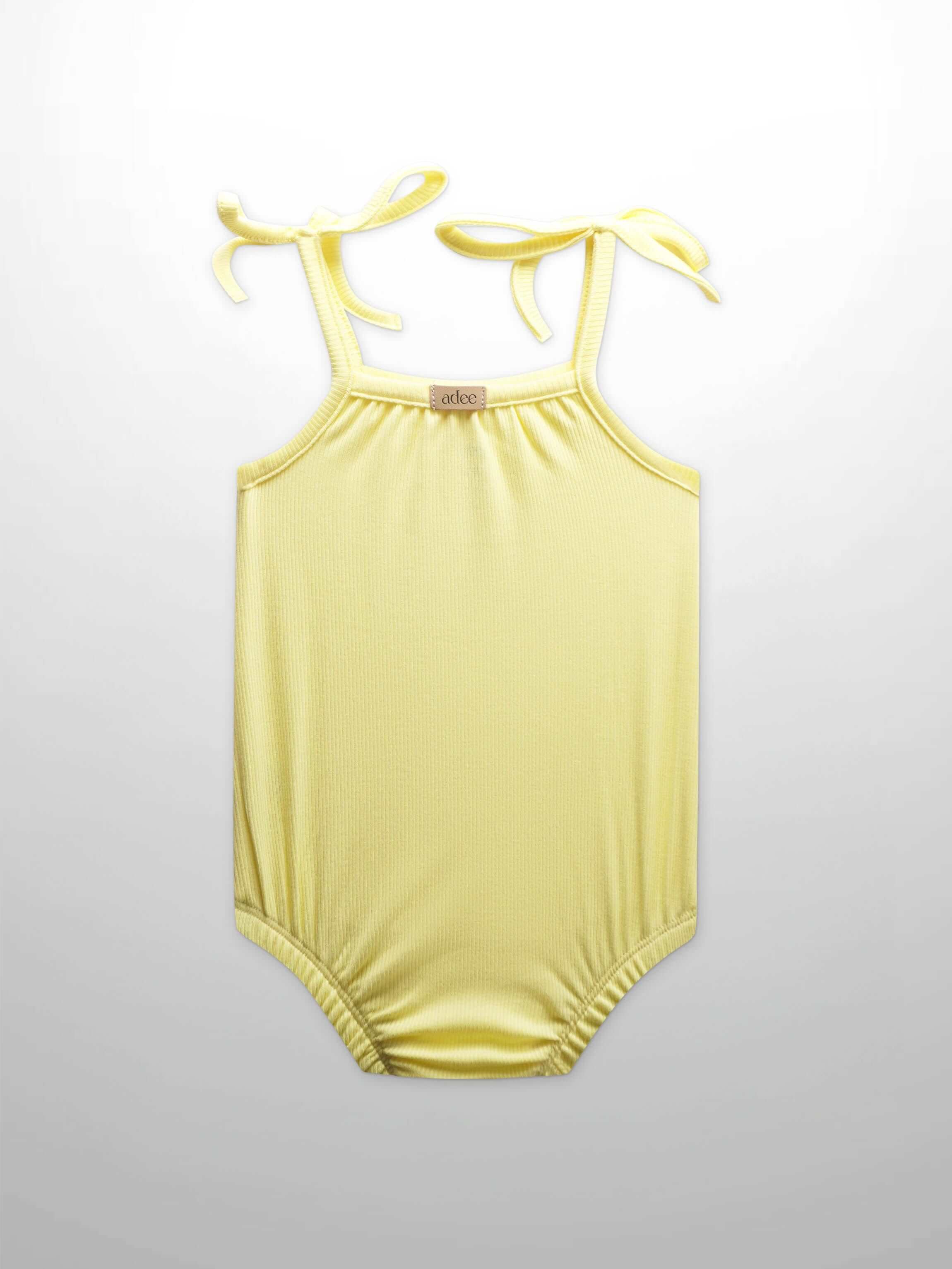 Yellow baby romper with bows