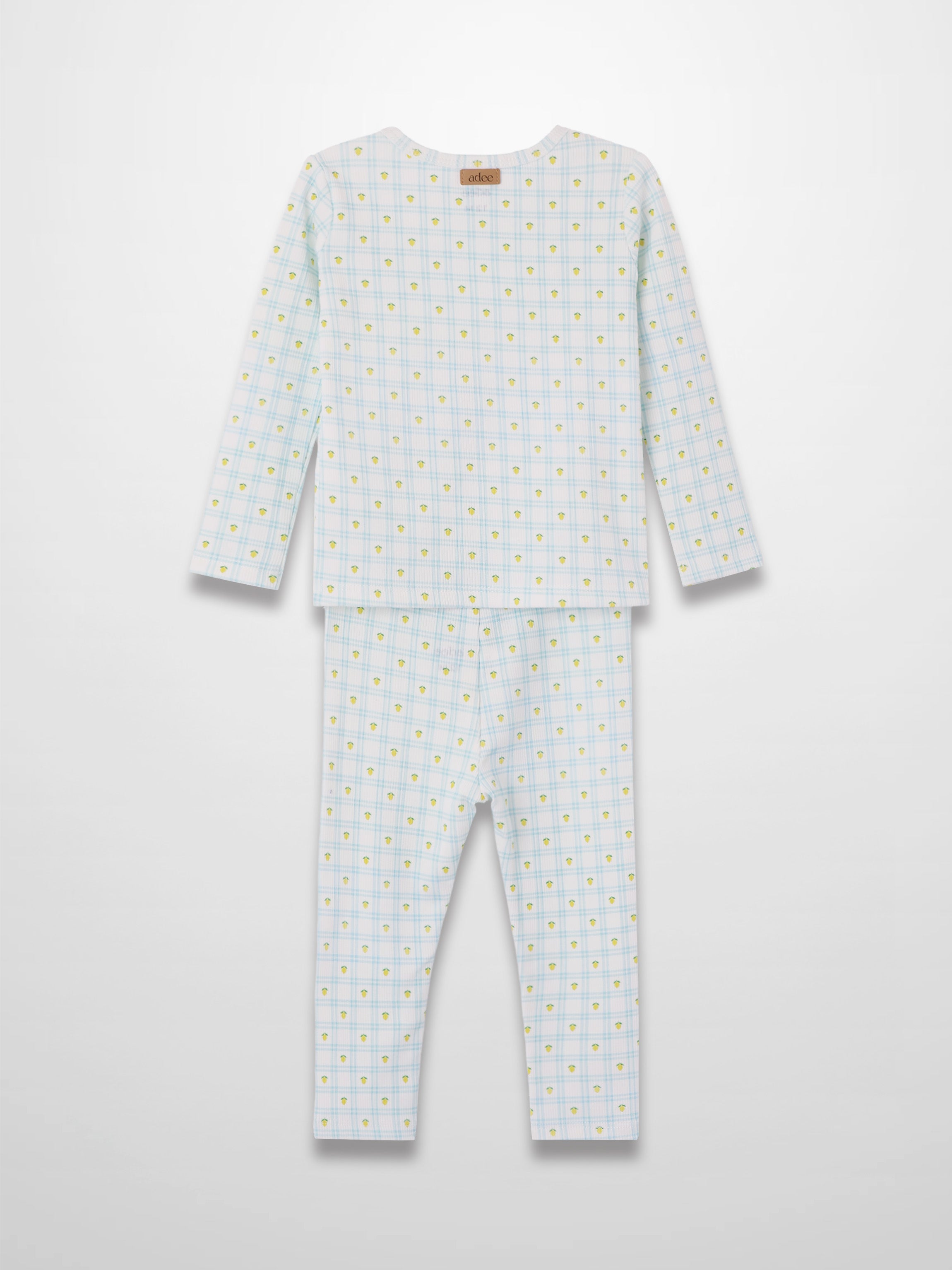 Lemon Window Pajamas: white base with light blue grid plaid and scattered yellow lemons, long-sleeve top and pants.