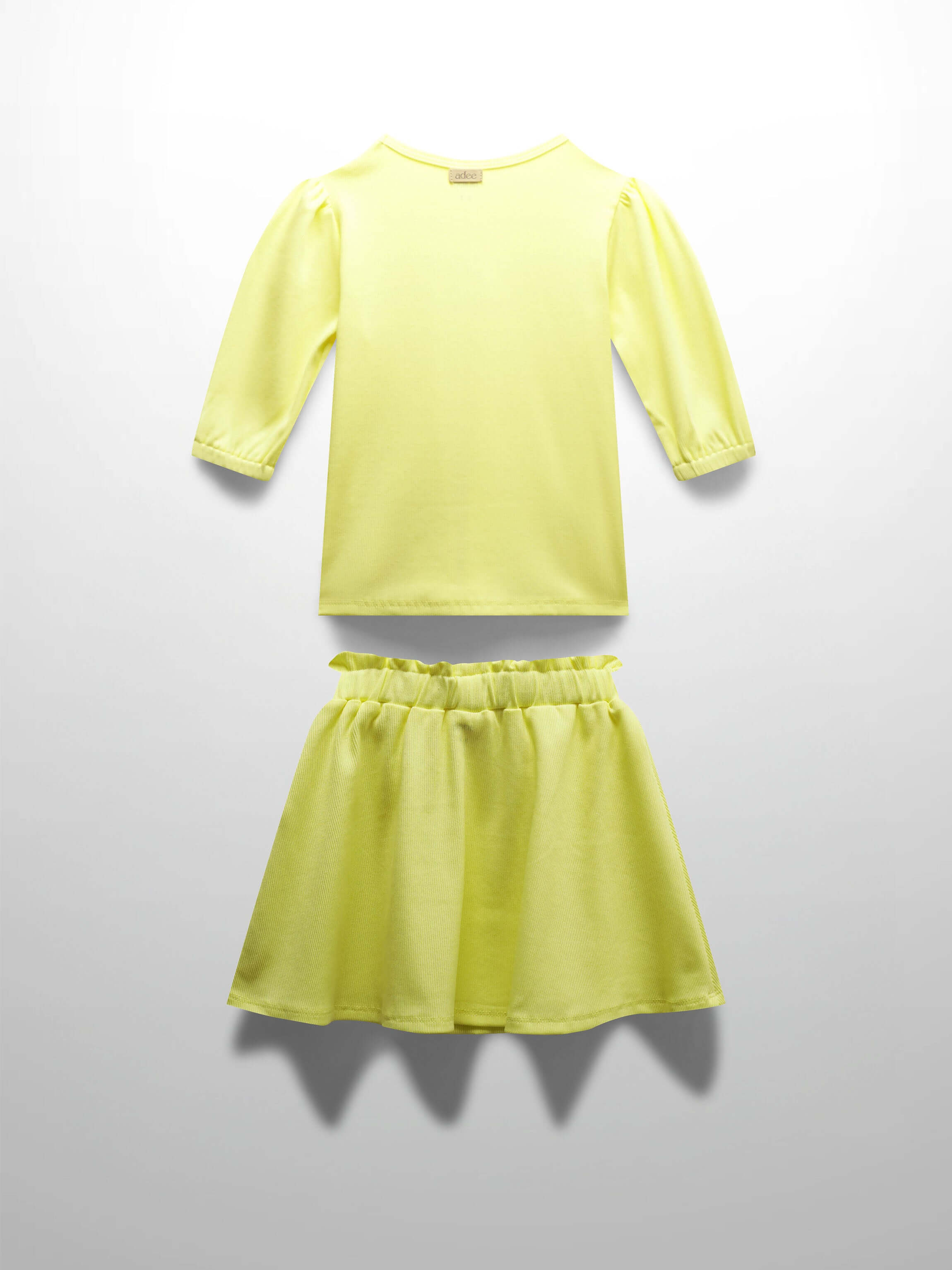 Yellow ribbed skirt and shirt for girls