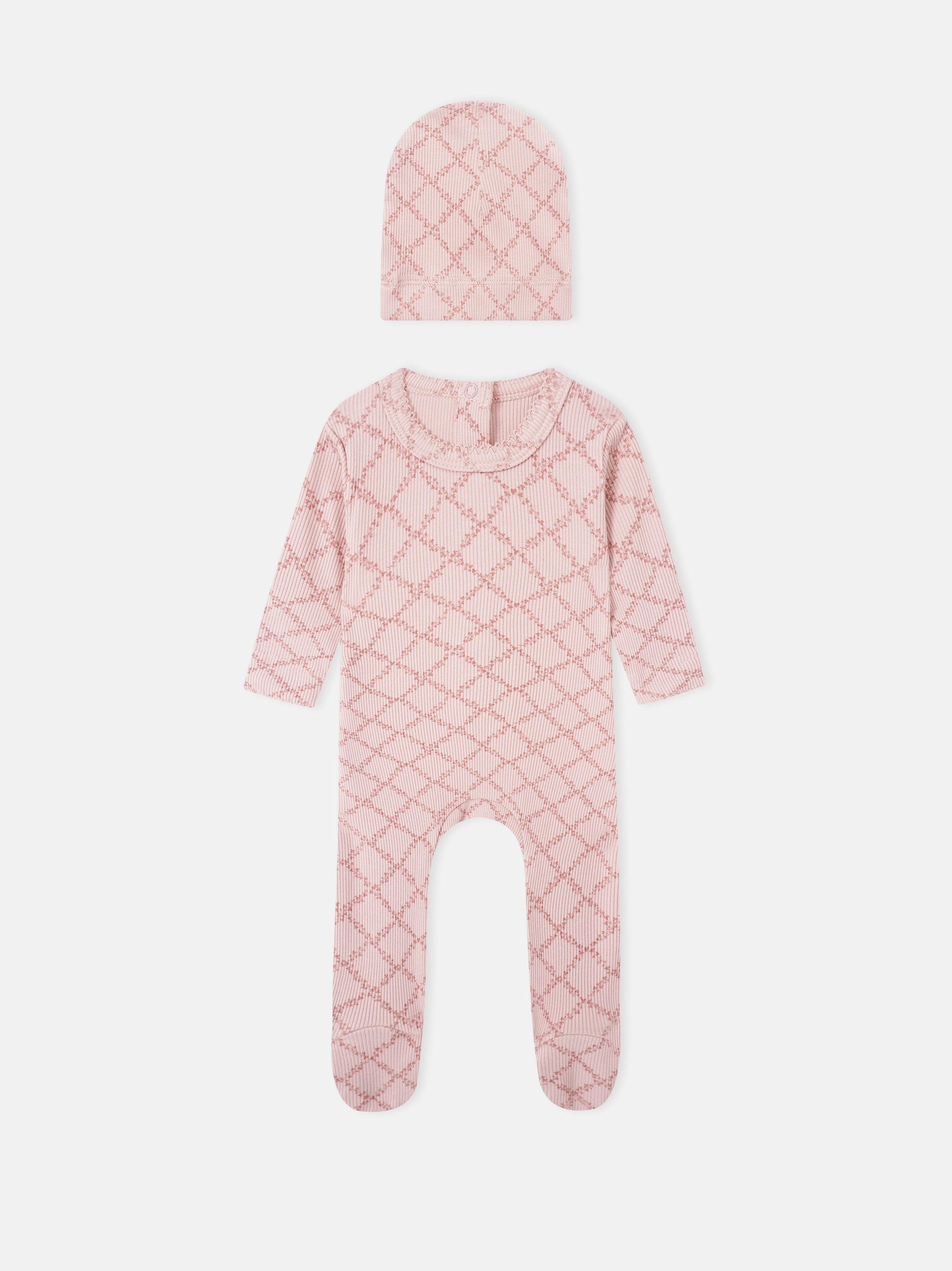 Adee Pink Leaf two-piece layette set for girls; knit hat and footed romper in pink lattice pattern.