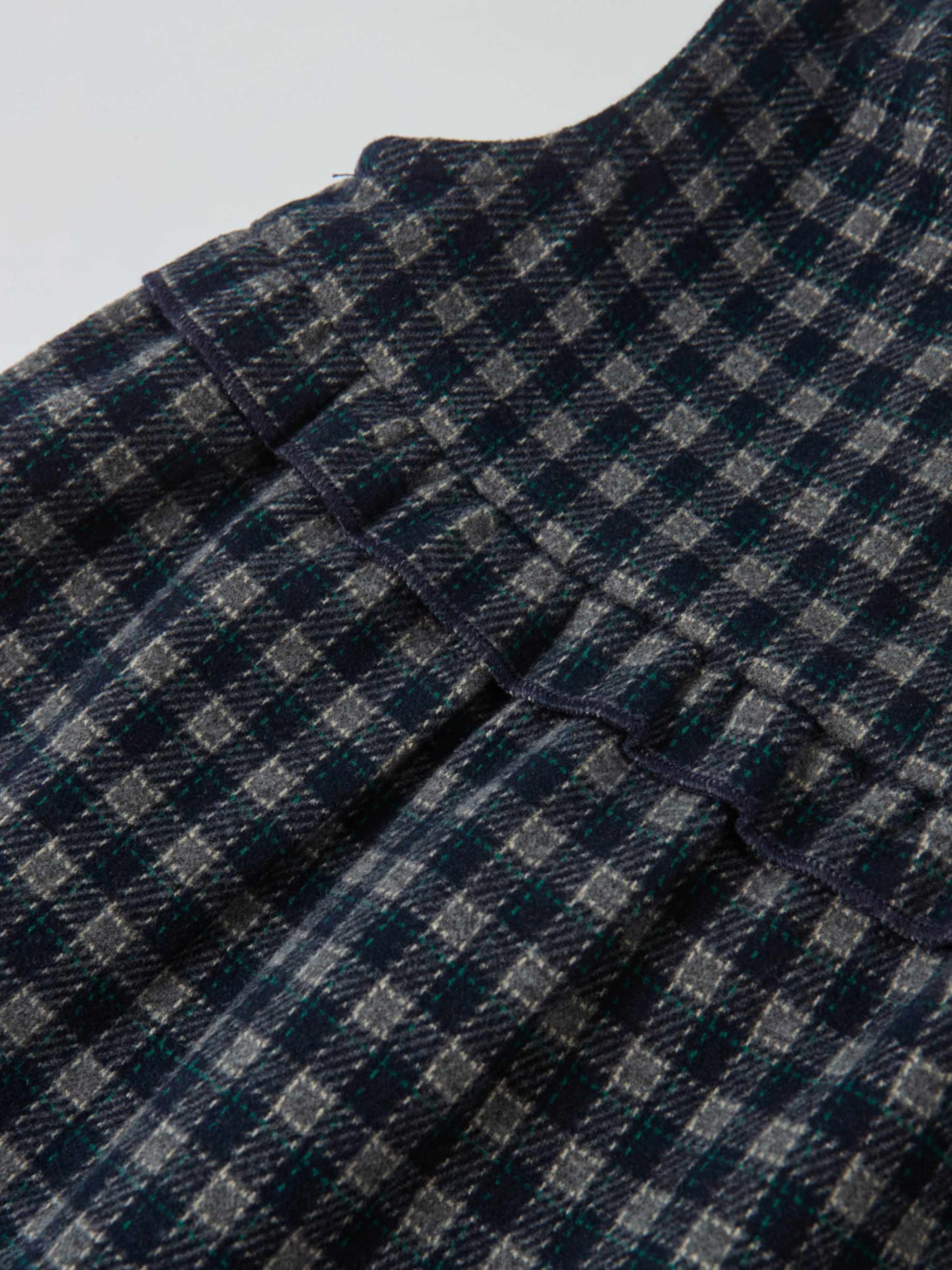 Plaid overalls with ruffles for girls in navy by Adee; dressy style, texture-rich plaid fabric detail.