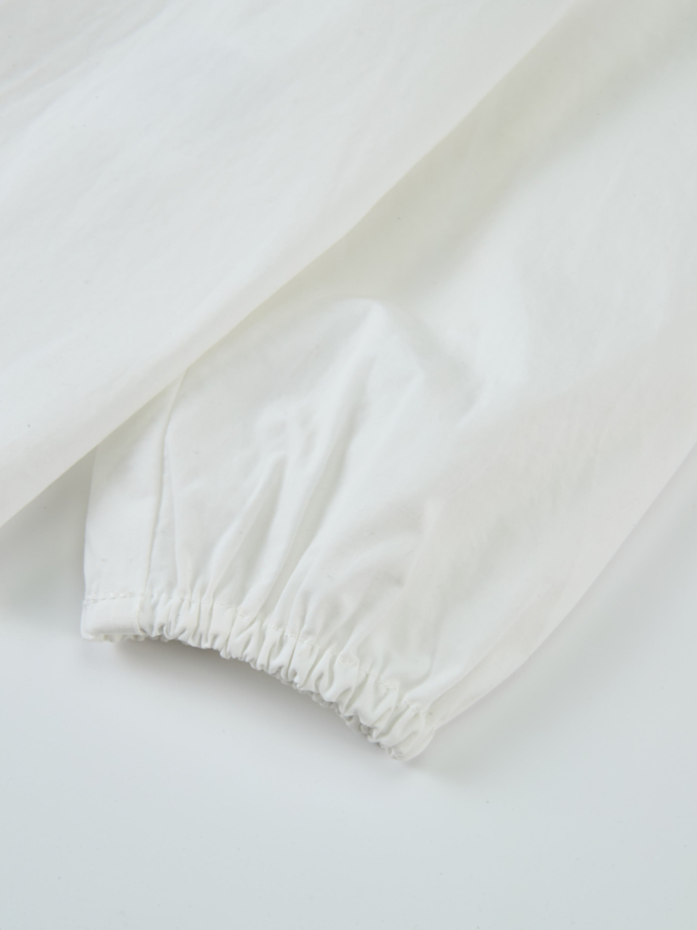 Peter Pan Collar Blouse in white for girls; dressy long-sleeve top with elastic cuffs by Adee.