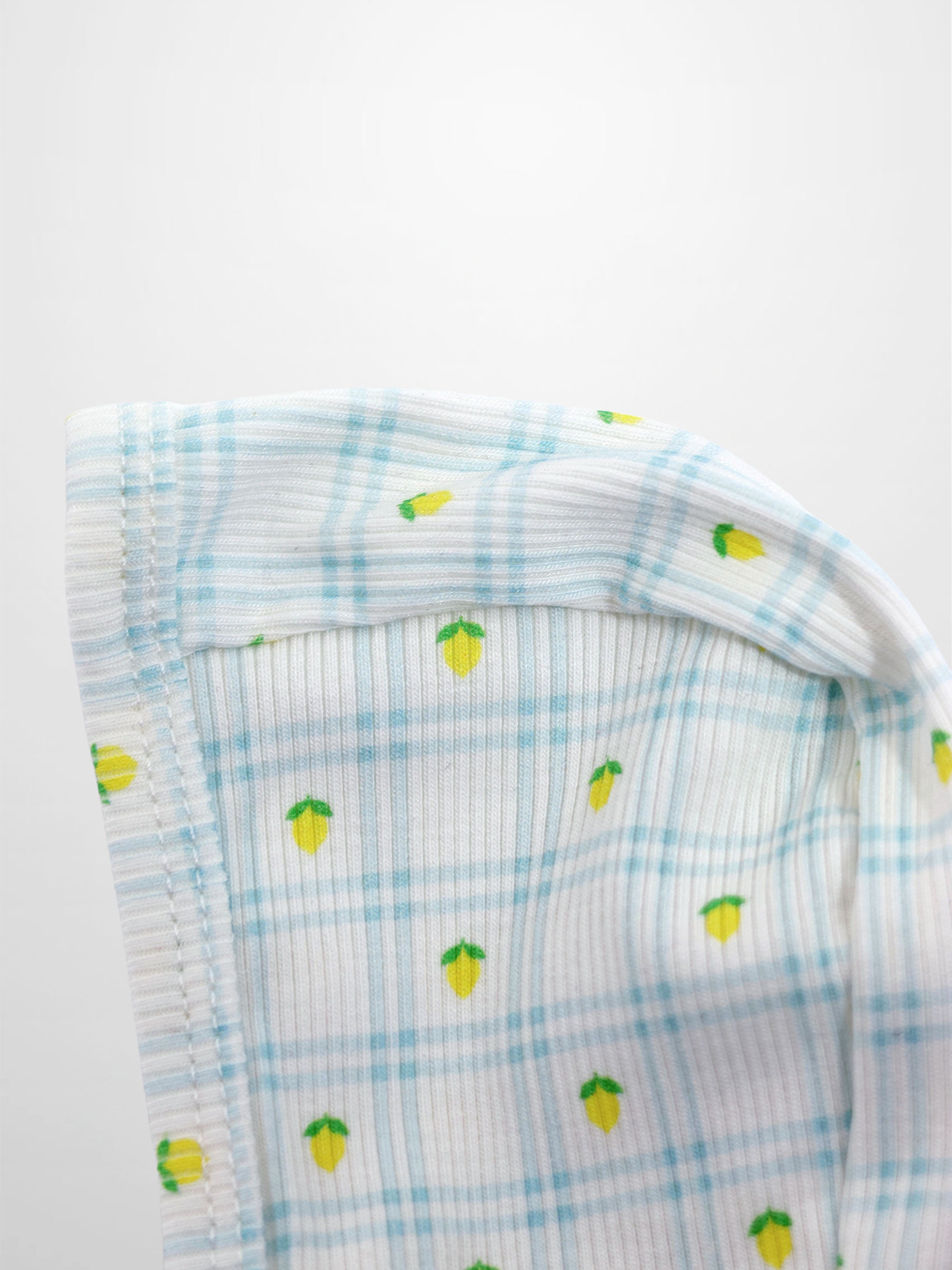 Lemon Window Bonnet for boys by Adee; light blue plaid with small yellow lemon prints.