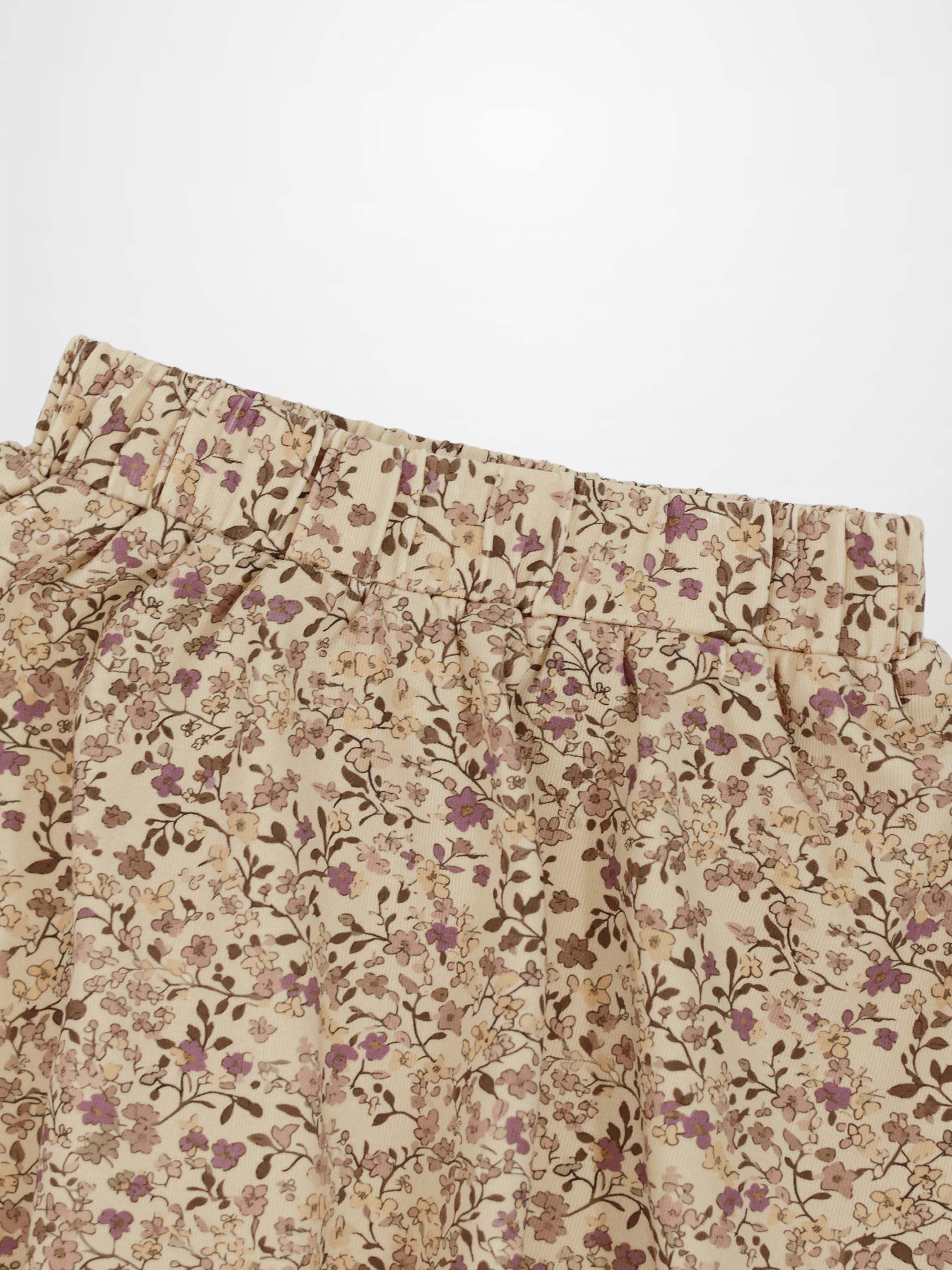 Beige floral-printed skirt with purple flowers and elastic waistband.