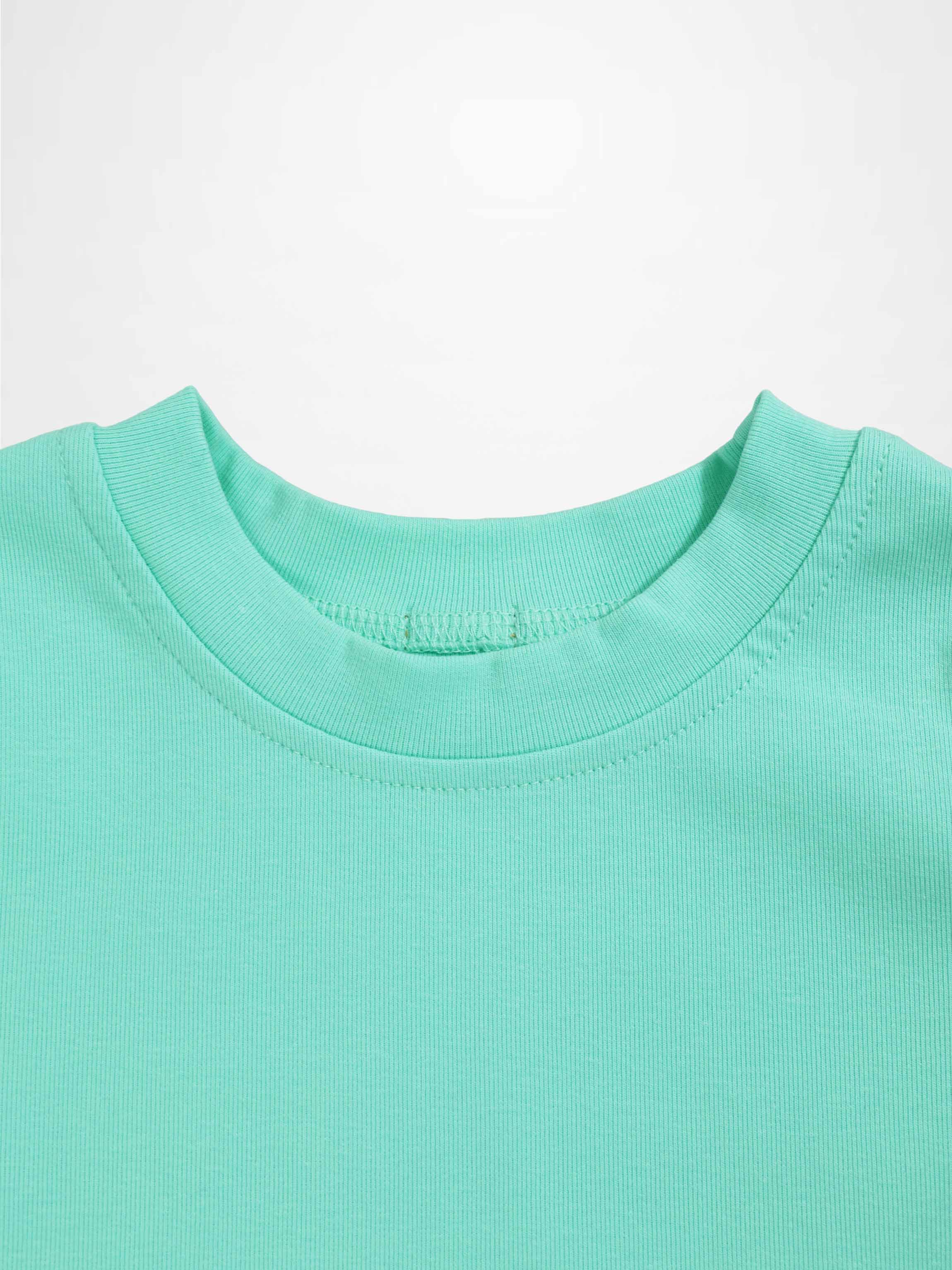 Mint green thin ribbed T-shirt neckline, close-up of fabric and stitching.