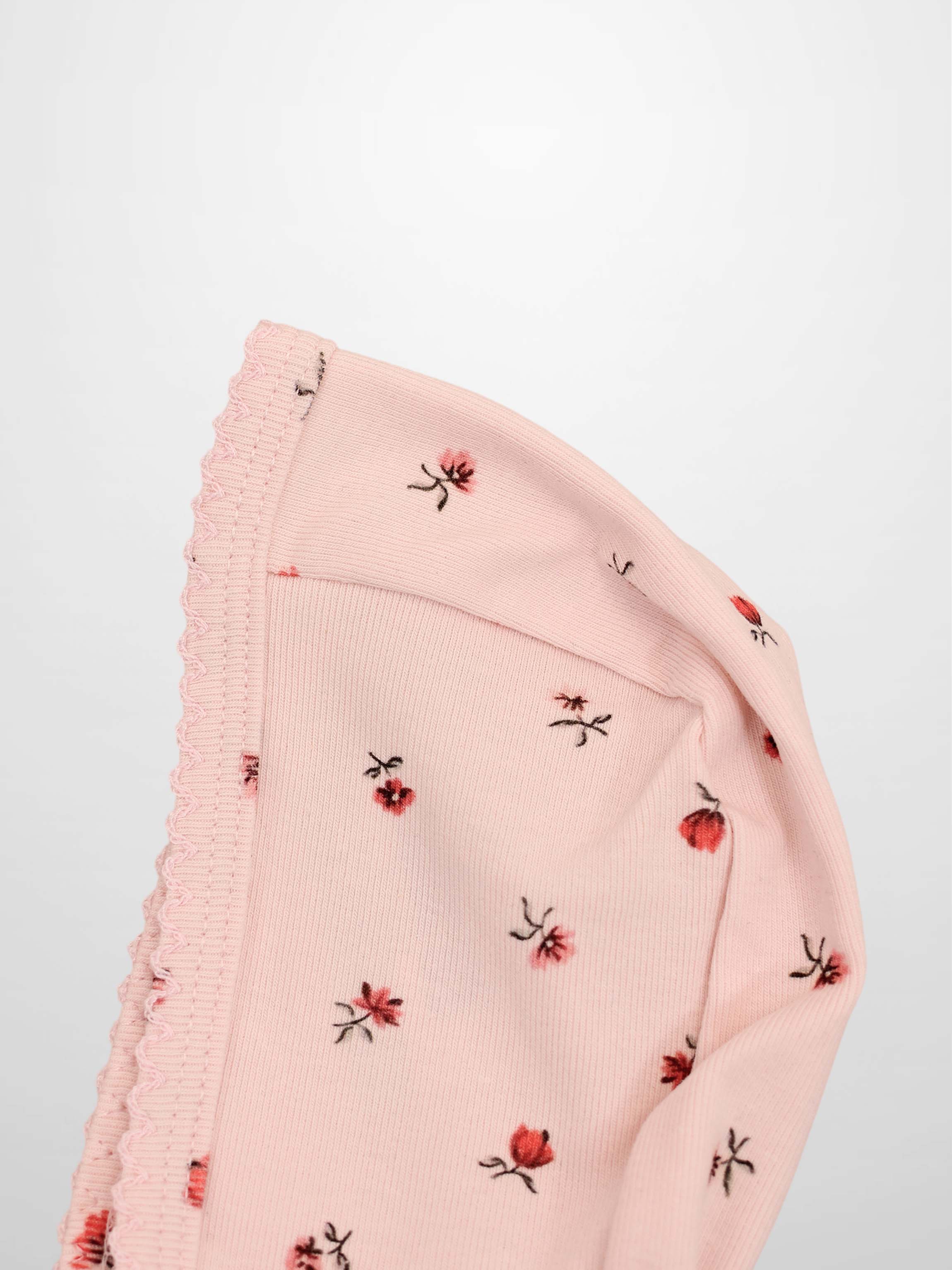 Pink Petal Bonnet for girls, pink knit with tiny red floral prints and scalloped trim.