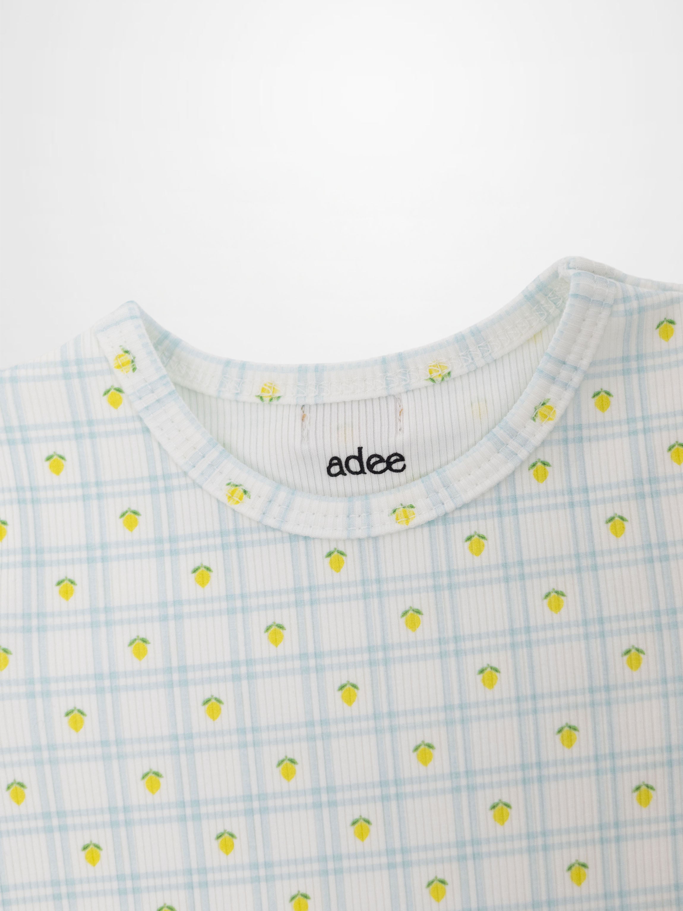Lemon Window Pajamas top in light blue plaid with tiny yellow lemons on white base; crew neck.