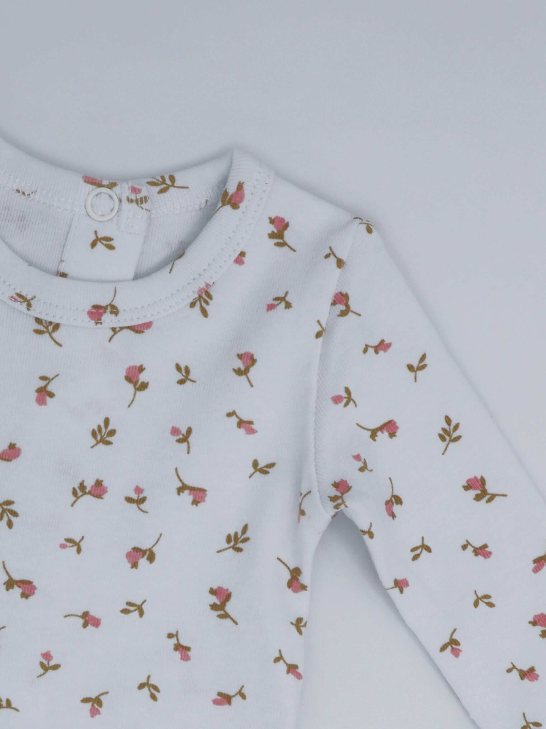 Pink baby jumpsuit footies with floral pattern