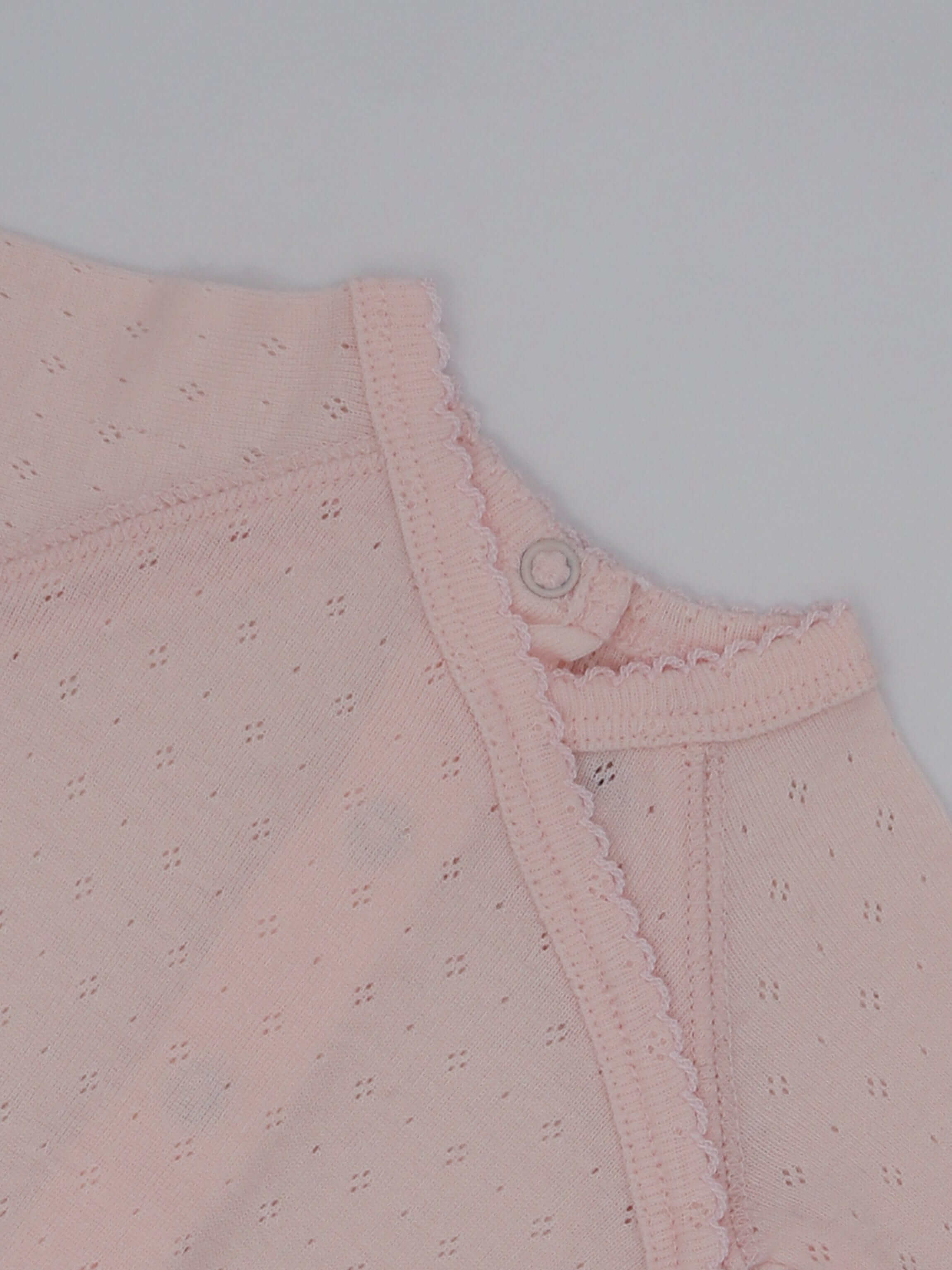 Baby jumpsuit pink scalloped trim
