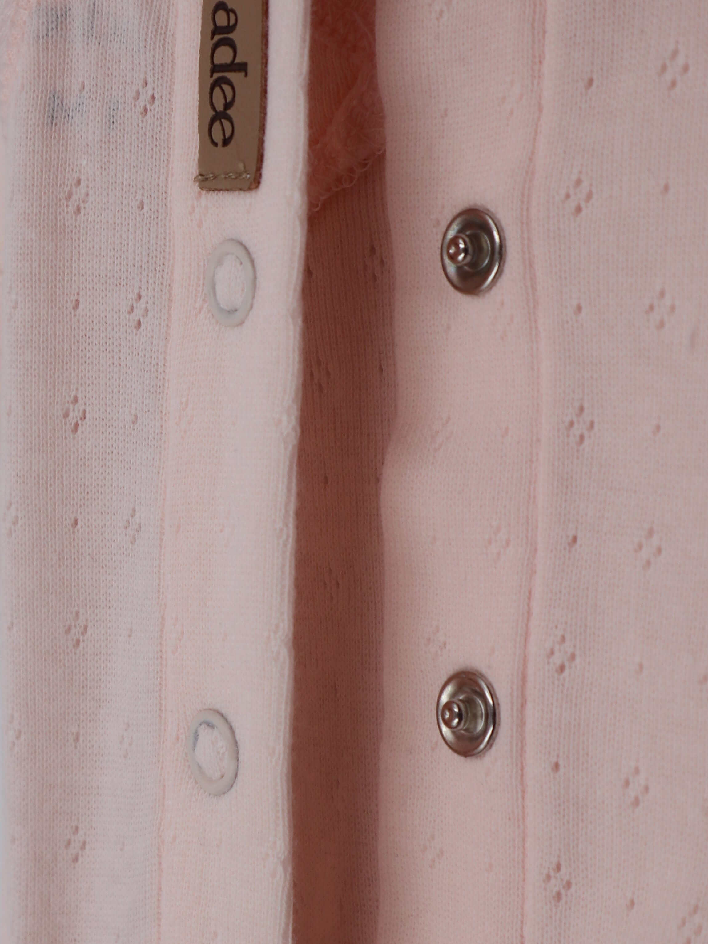 Light pink baby jumpsuit detail