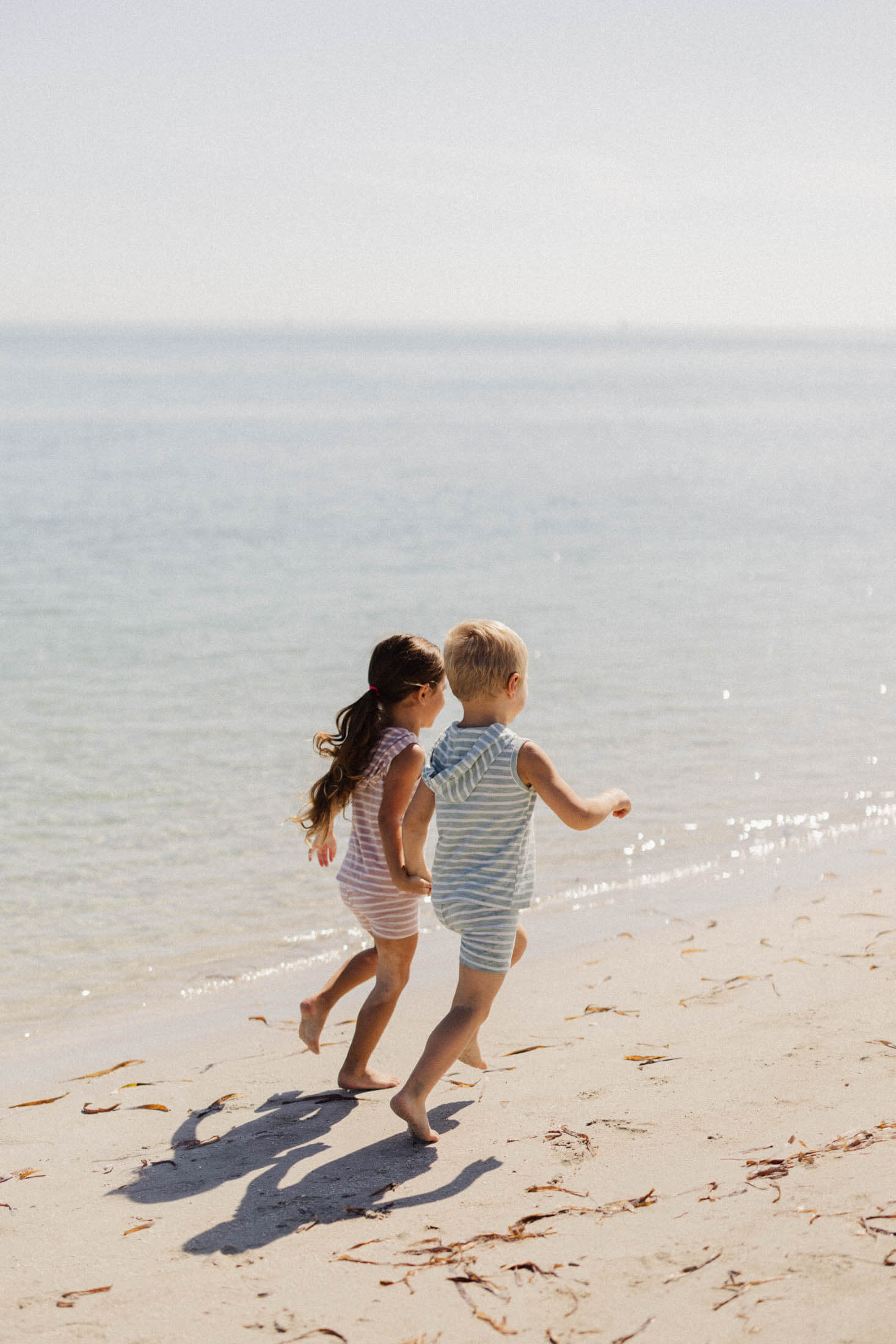 Kids running on the beach