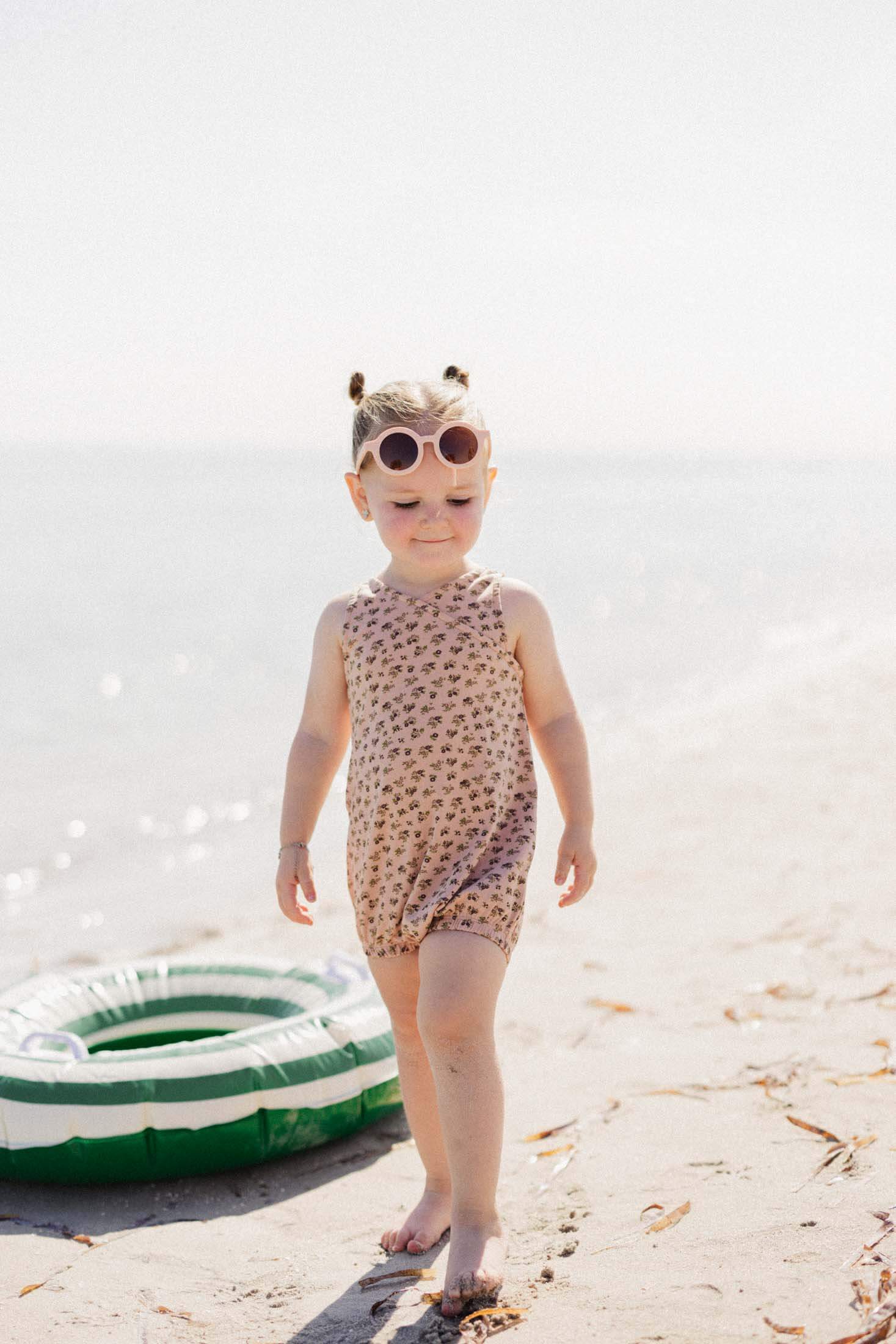 Girl walking on beach romper