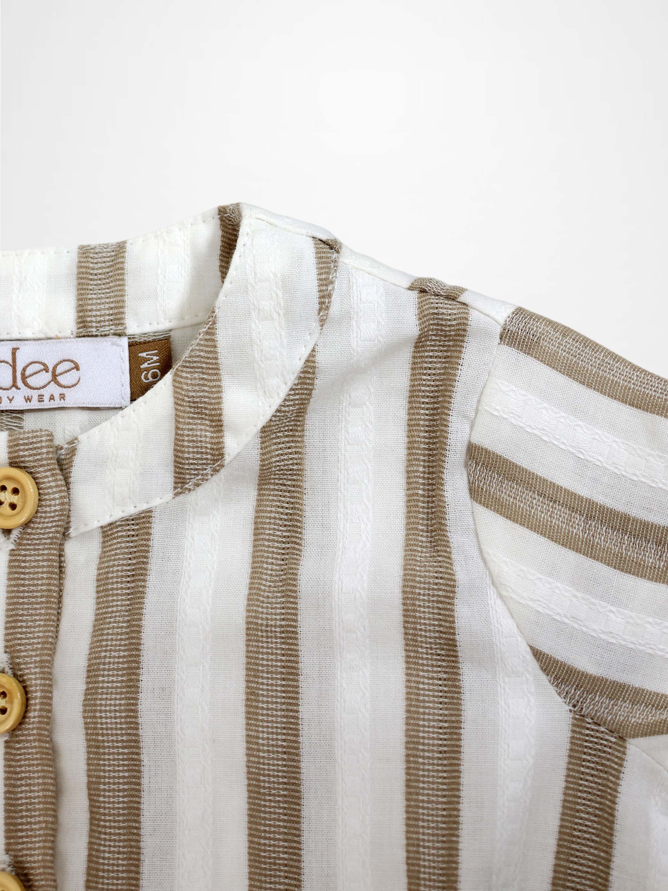 Tan and white striped romper with a collar and wooden buttons.