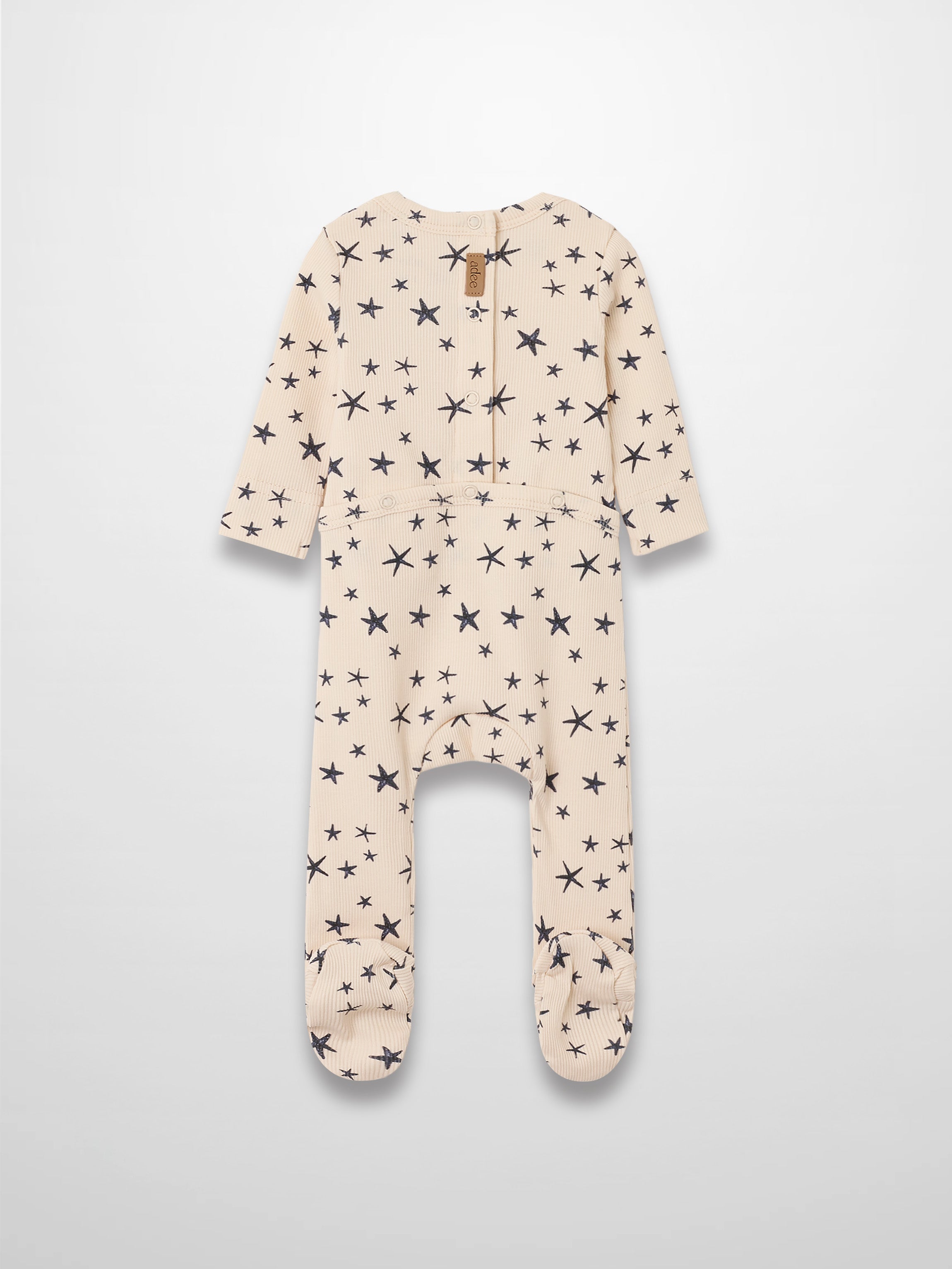 Star Stretchy footed romper for boys in light beige with navy star print by Adee