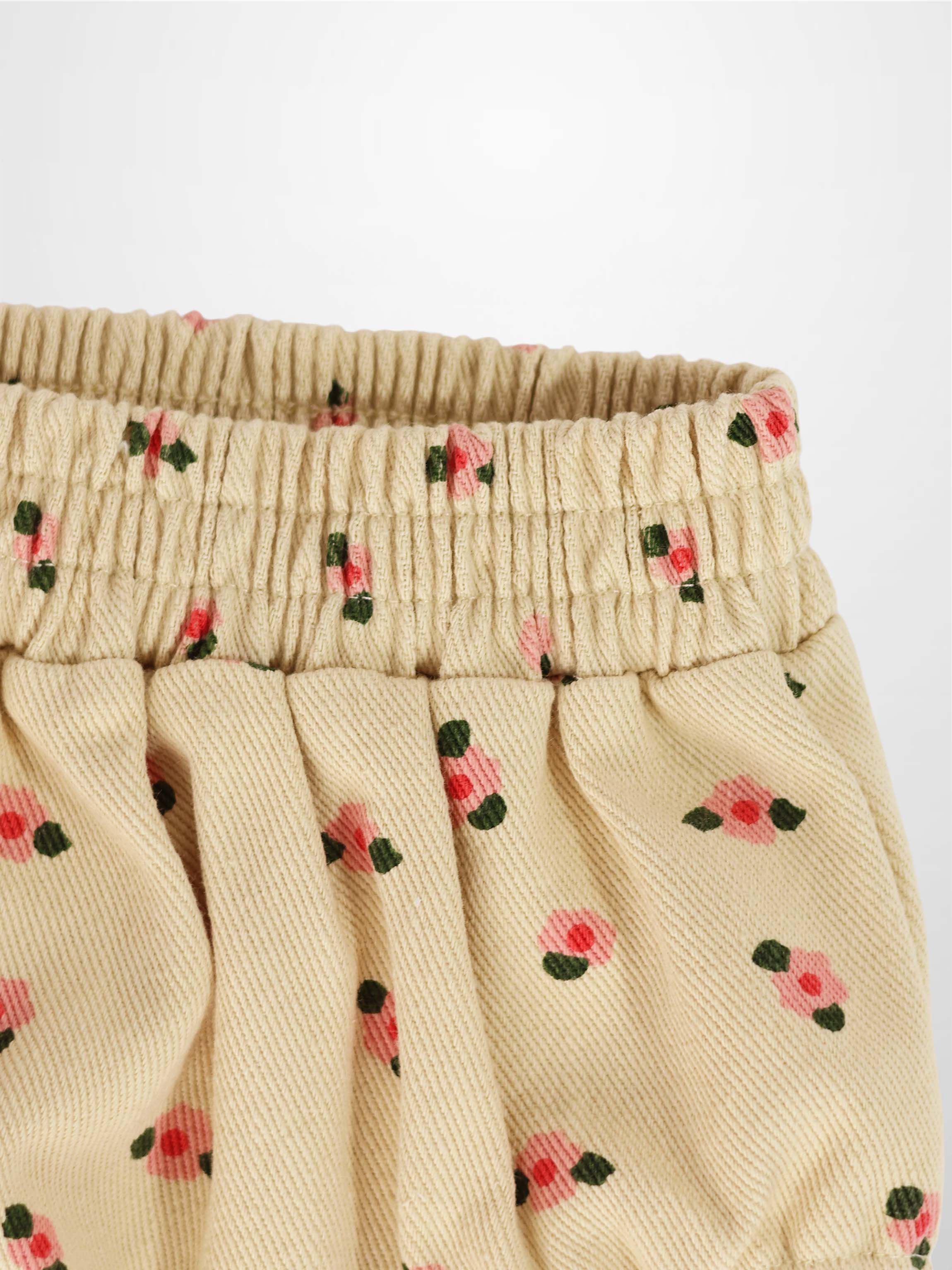 Tan Floral Bloomers with pink roses and green leaves, elasticized waistband and gathered fabric.