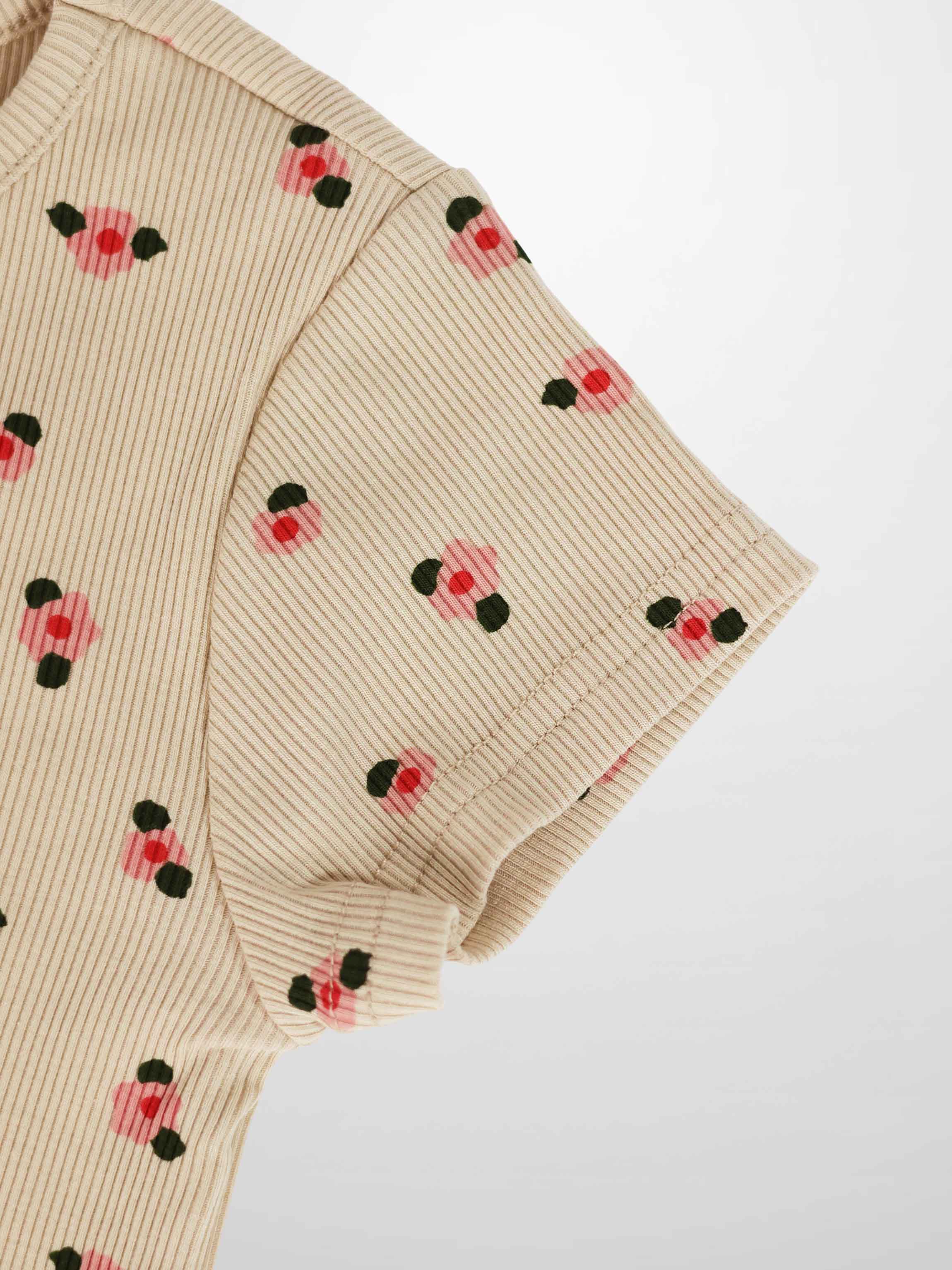 Adee tan floral short-sleeve girls’ T-shirt, ribbed knit with pink flowers and green leaves.