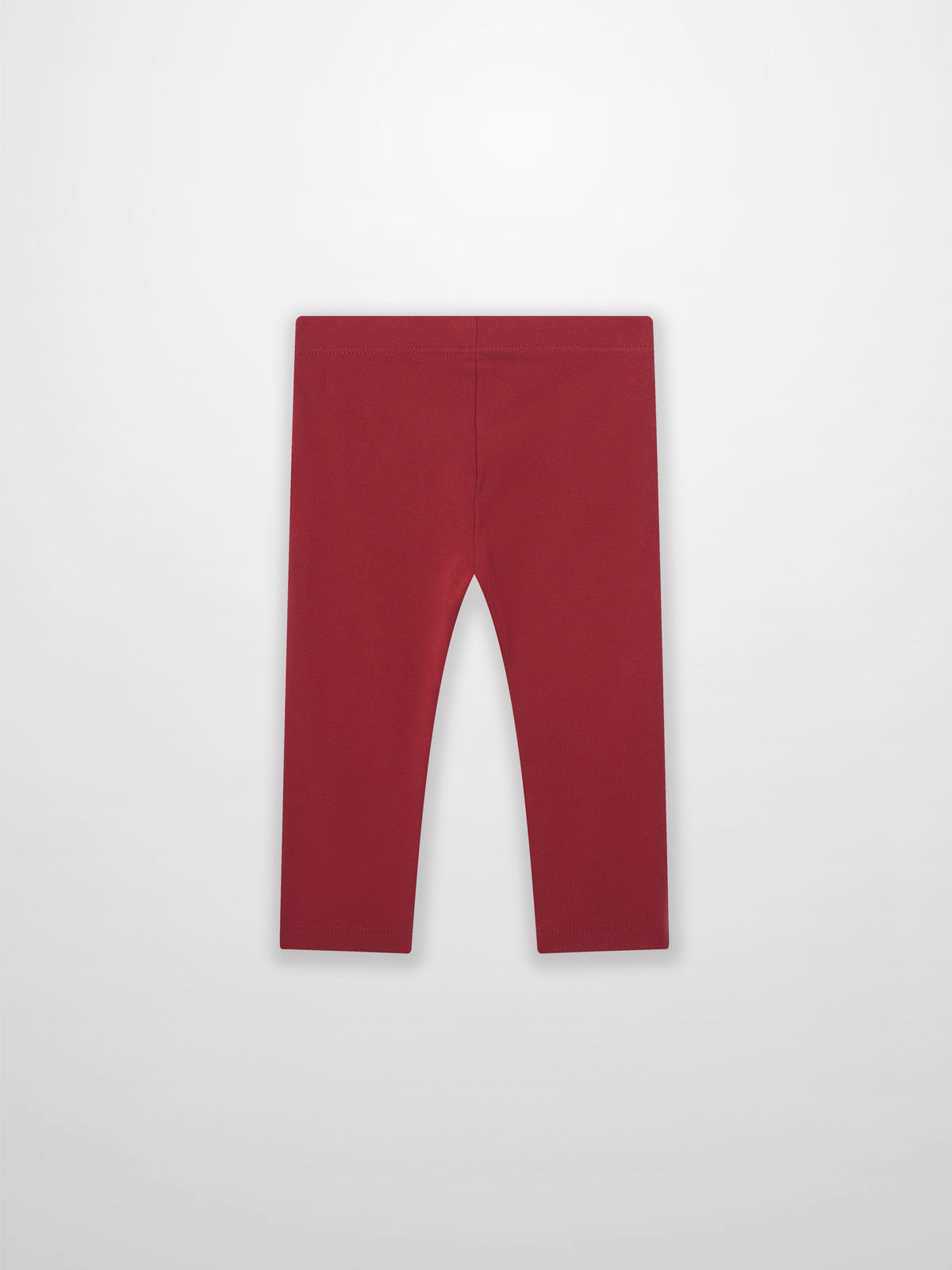 Non ribbed red leggings for unisex bottoms; plain fabric with visible waistband.