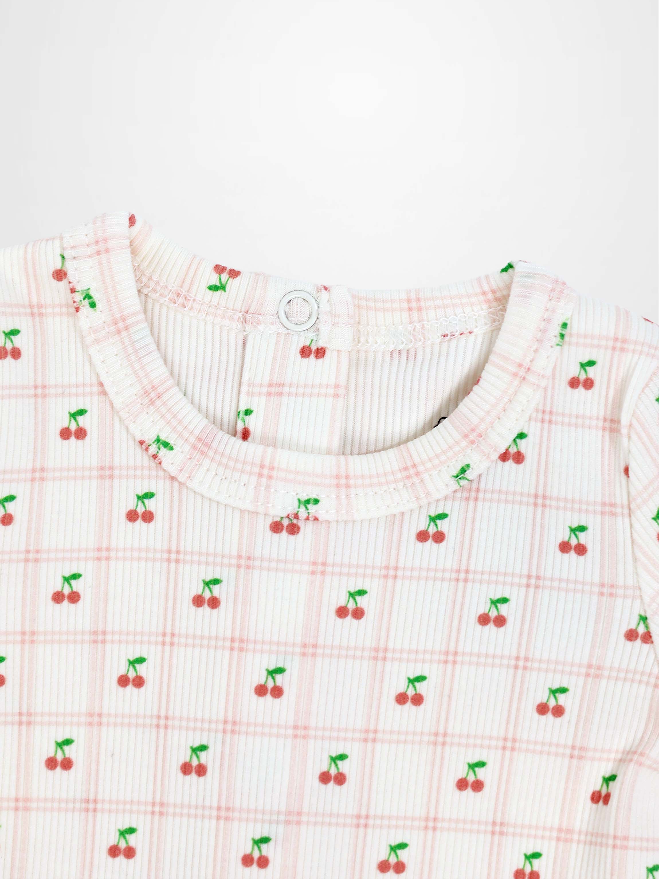 Cherry Window Stretchy girls top featuring tiny red cherries on pale pink plaid knit fabric with round neckline