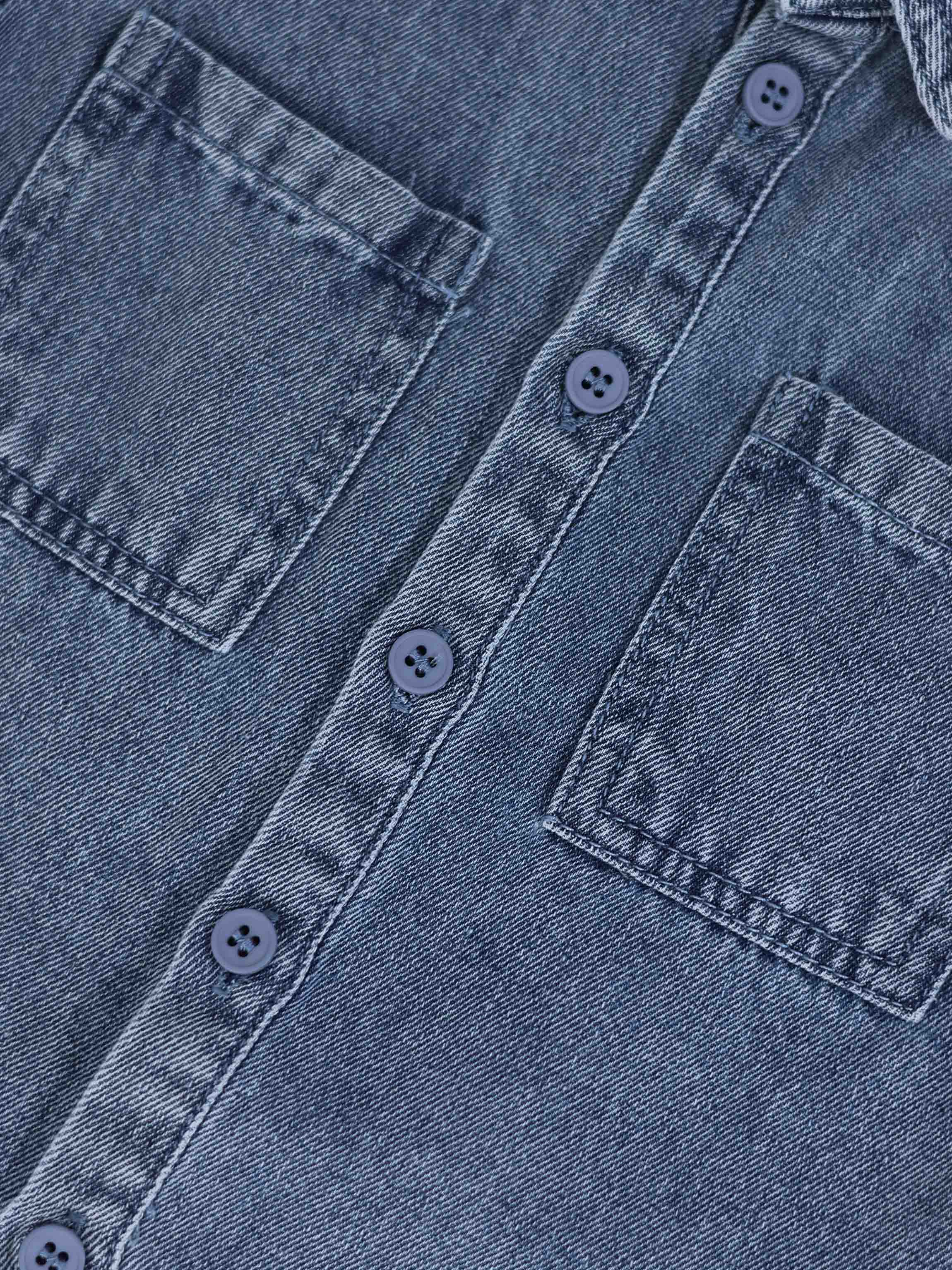 Blue denim button-down shirt for boys with front pockets and blue buttons