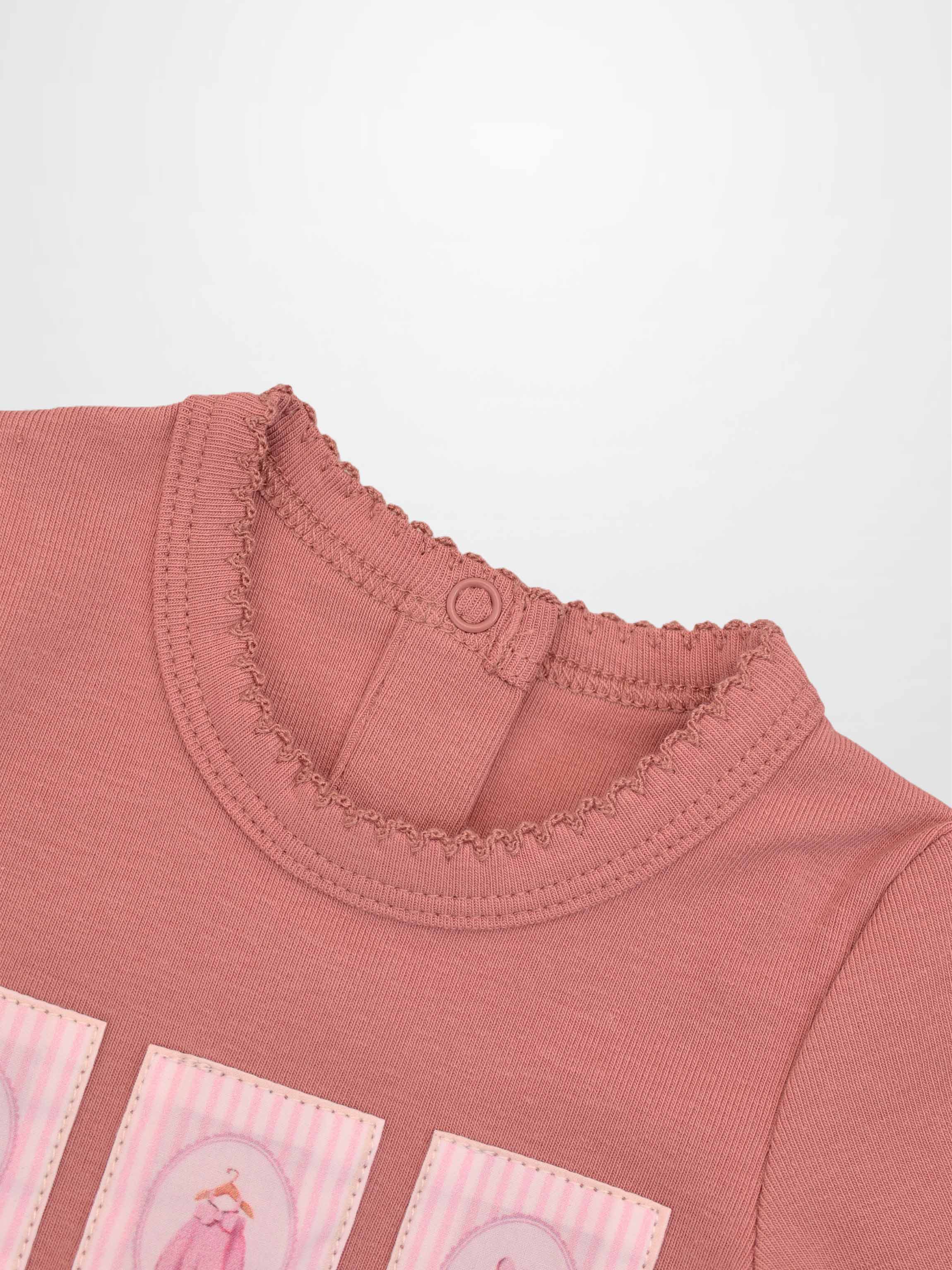 Cherry Frame Stretchy girls jumpsuit in muted pink knit with back neck snap closure.