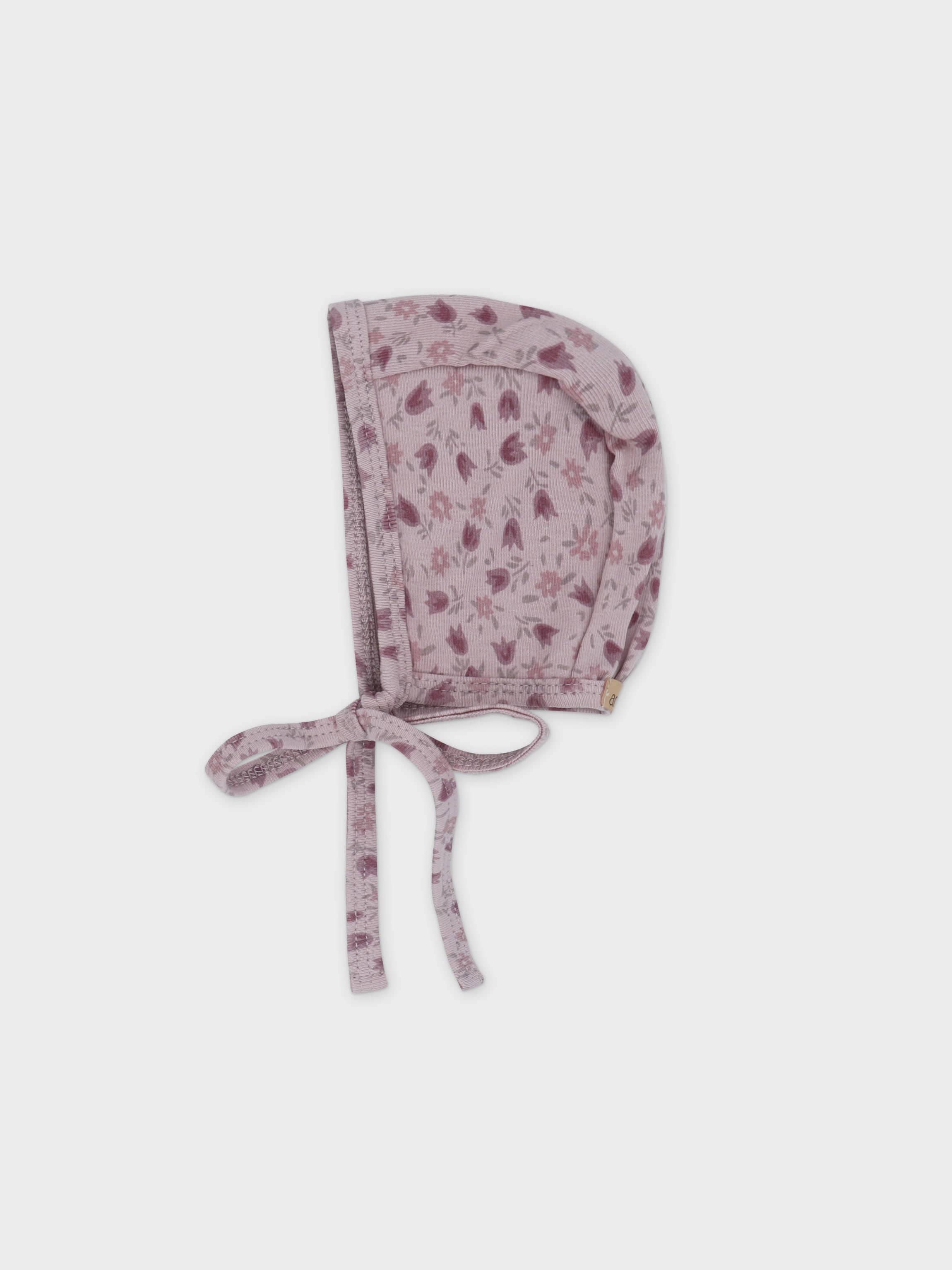Pink baby bonnet hat with floral print.