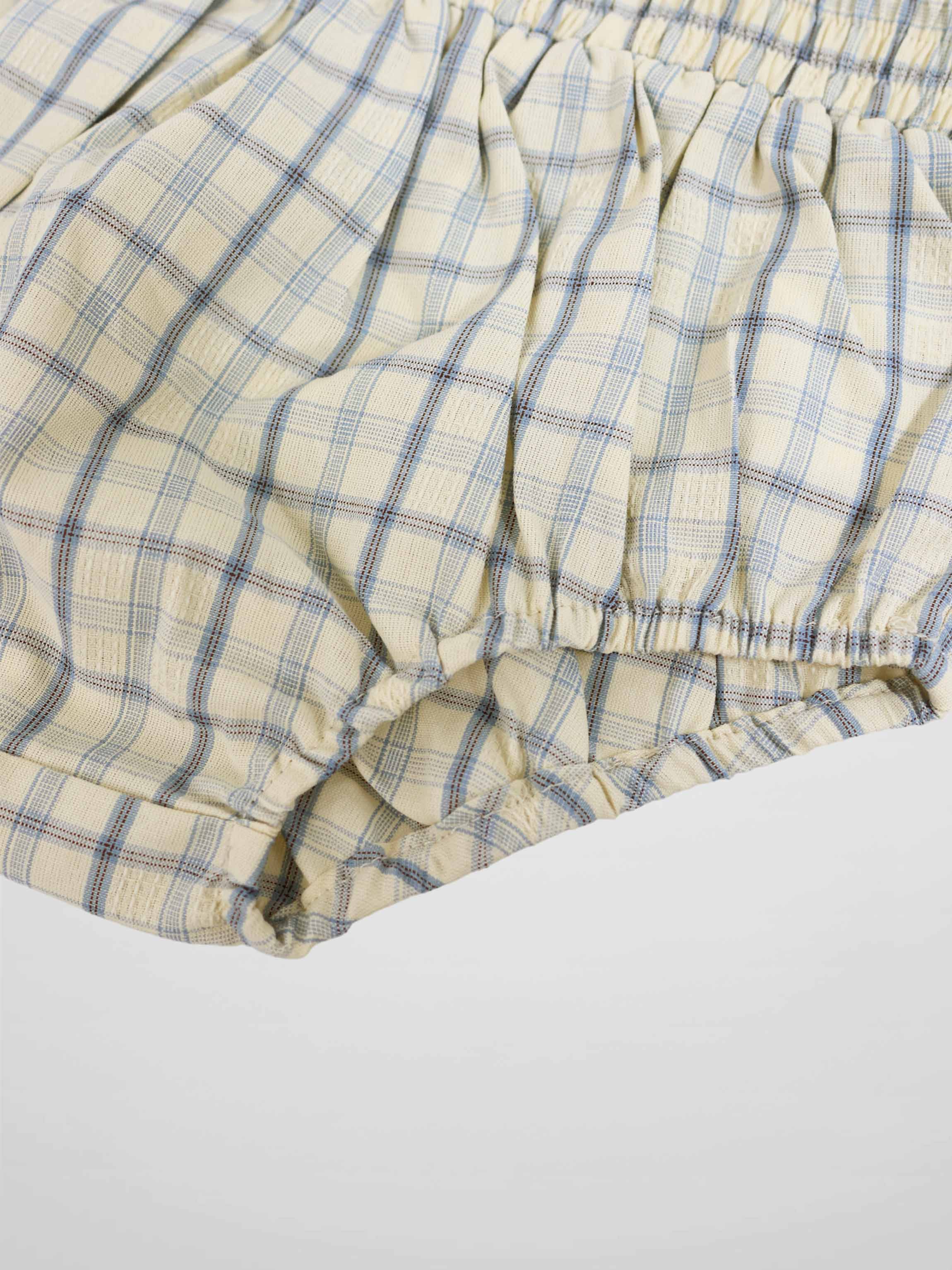 Adee Plaid Bloomers for boys; beige plaid fabric with blue lines, elastic waist and leg cuffs.
