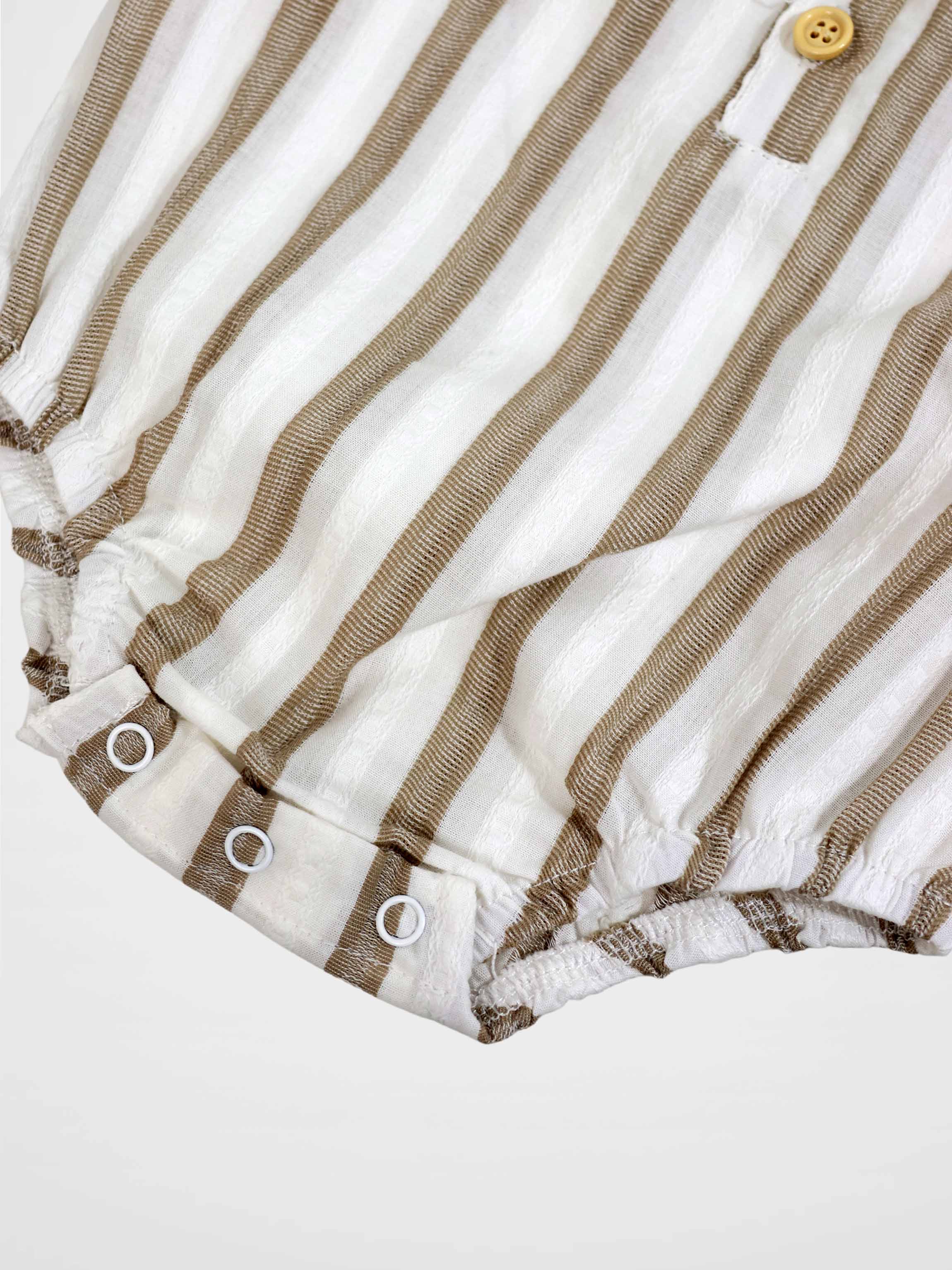 Tan and white striped romper with front button and snap-adjustable leg openings.