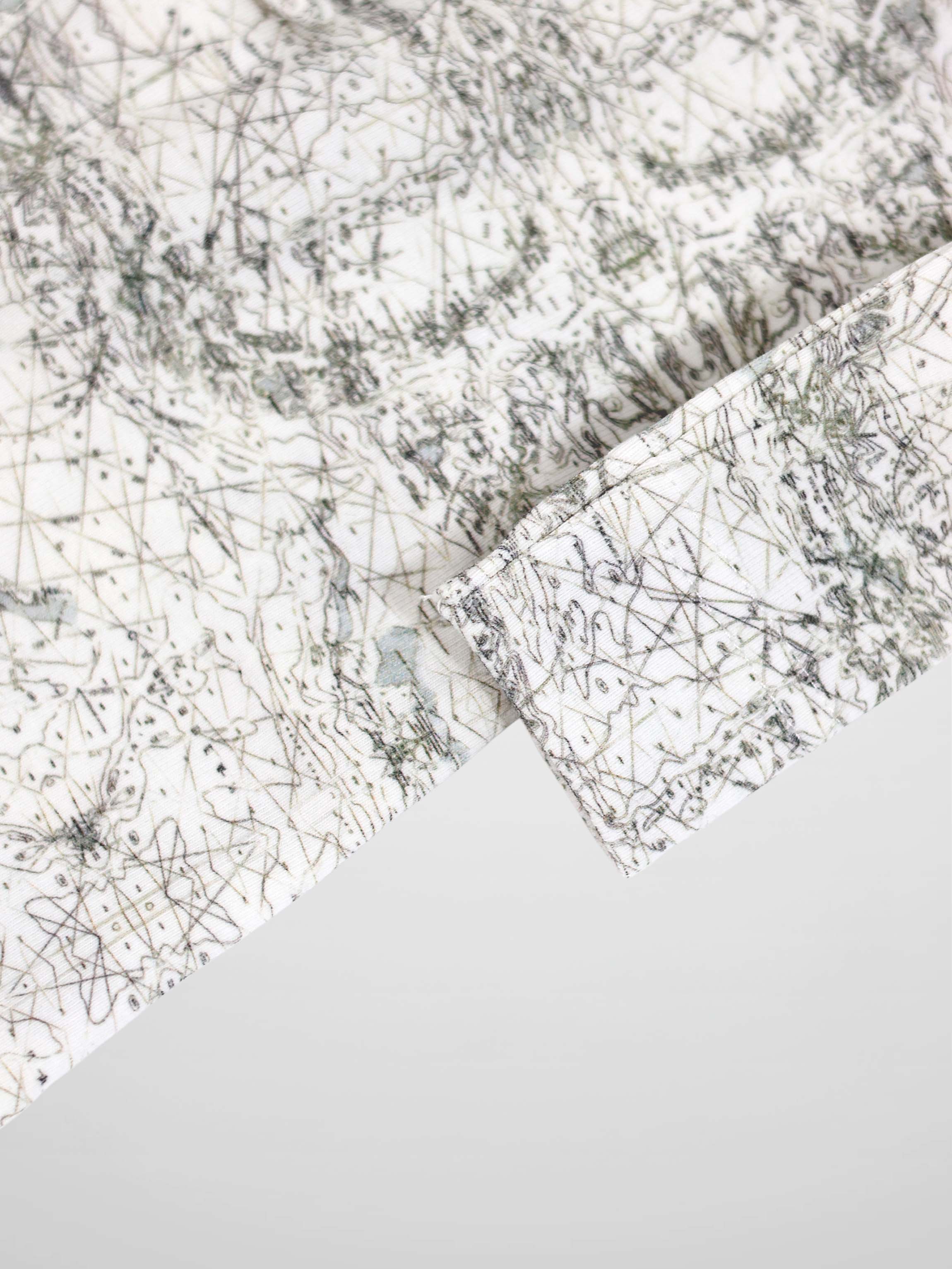 Map Stretchy: off-white fabric with sage-green map lines and compass markers.
