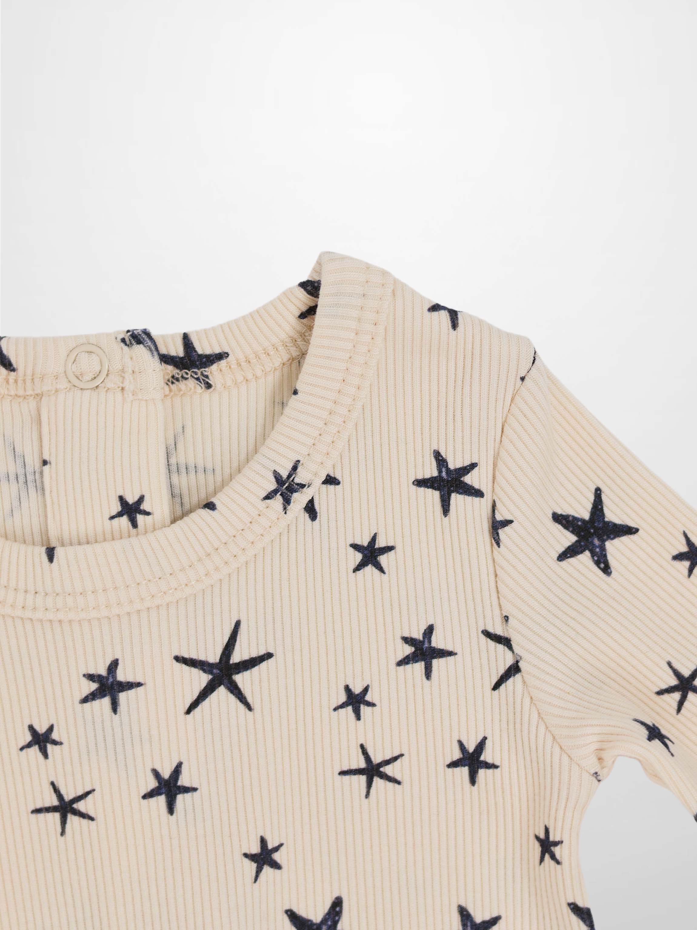 Star Stretchy boys stretchies top in light beige ribbed knit with navy star print by Adee
