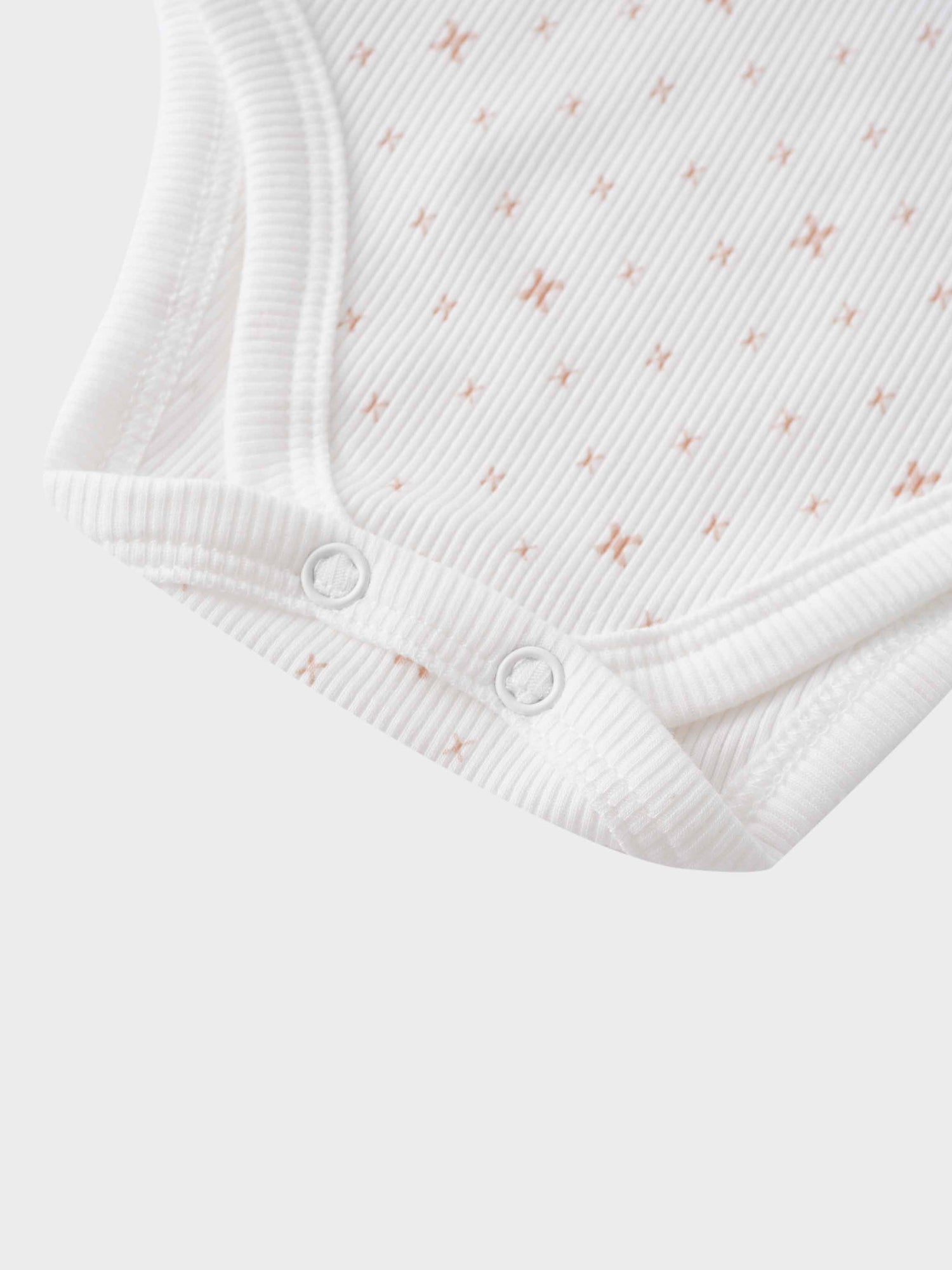 White baby bodysuit with snaps