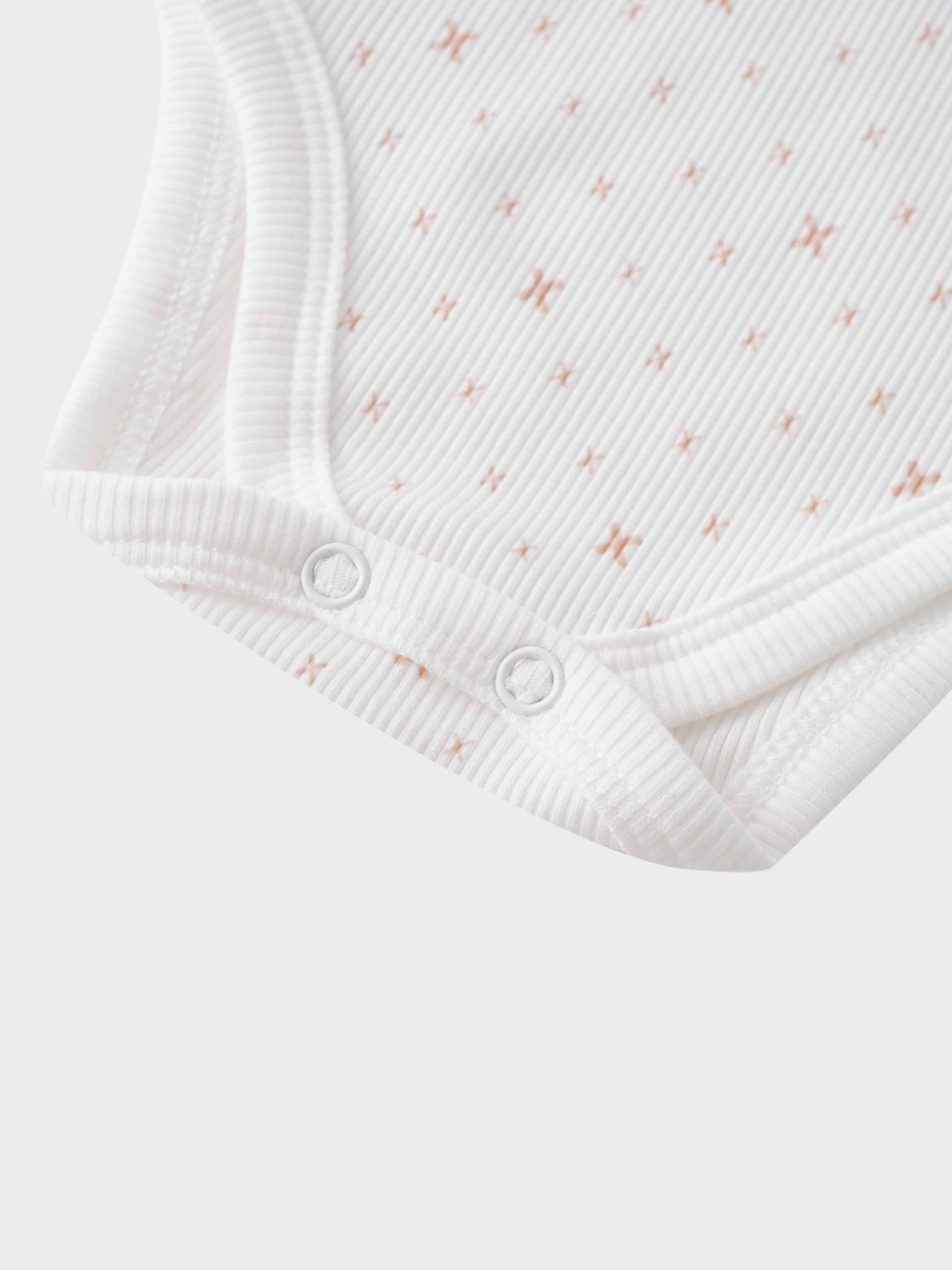 White baby bodysuit with snaps