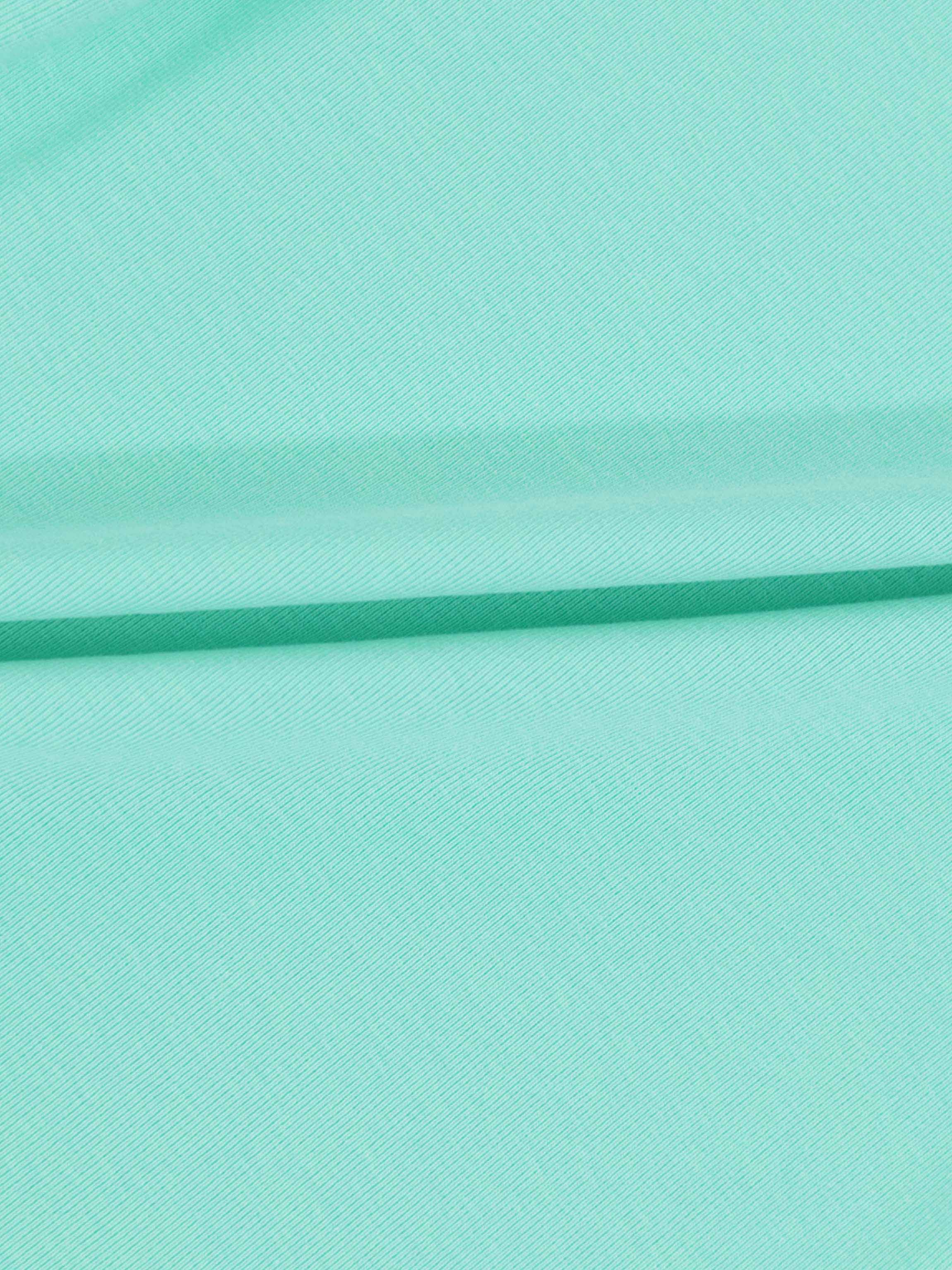 Mint green thin ribbed T-shirt fabric with soft folds.