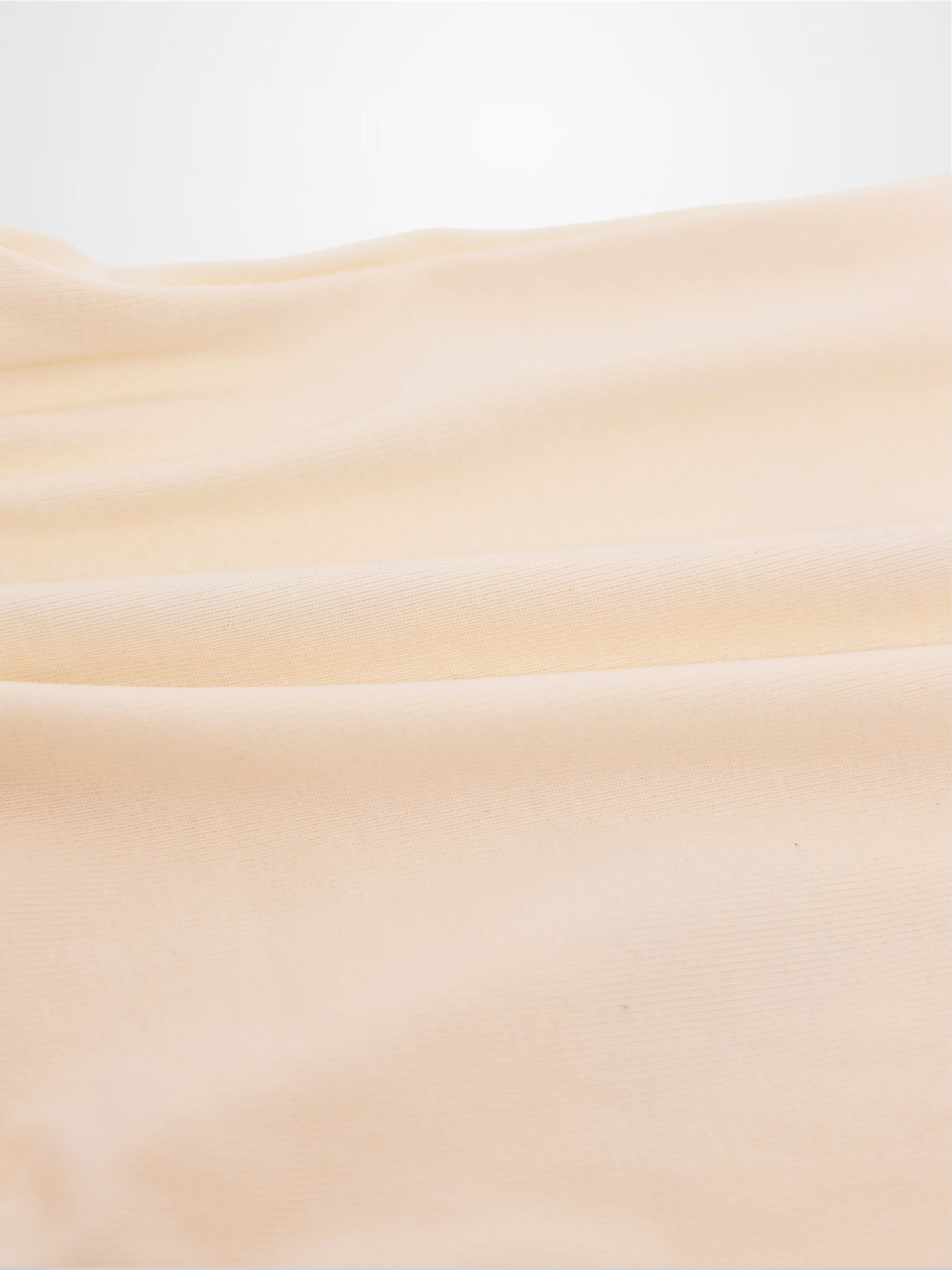 Sail Boat Romper by Adee; peach fabric close-up for boys romper